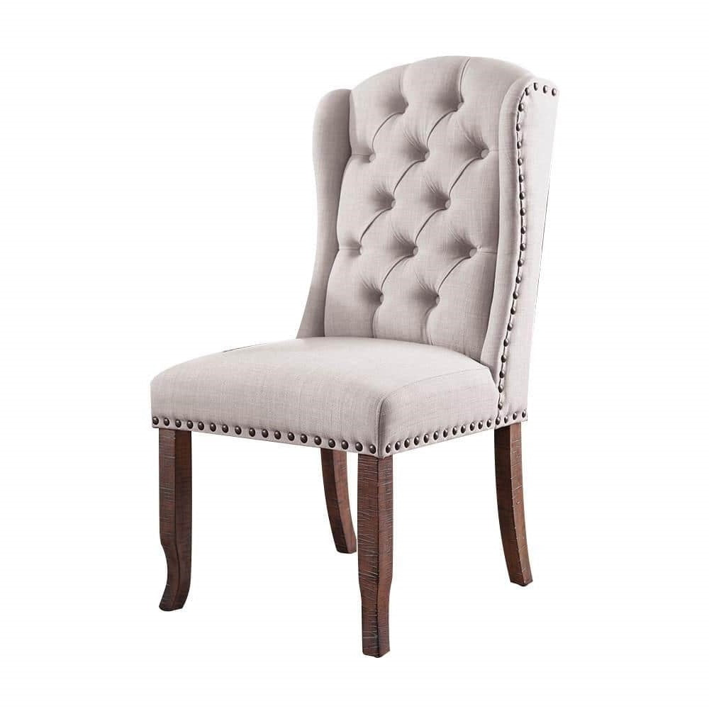 Tufted linen dining chair with nailhead trim
