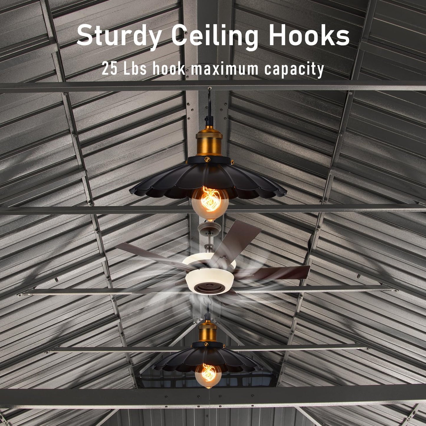 Closeup of two black industrial pendant lights with exposed Edison bulbs hanging from sturdy ceiling hooks