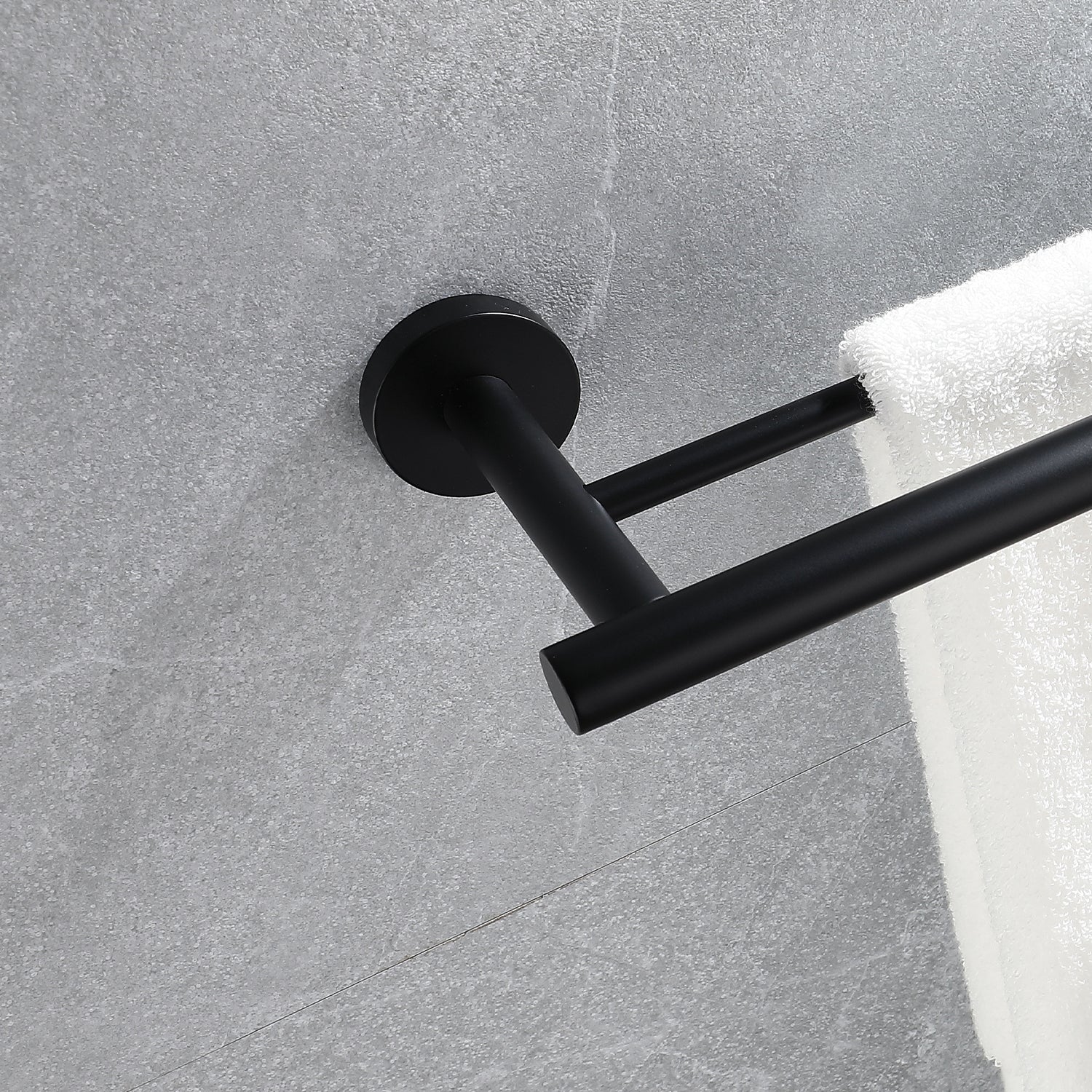 Modern black double towel bar mounted on a gray tiled wall