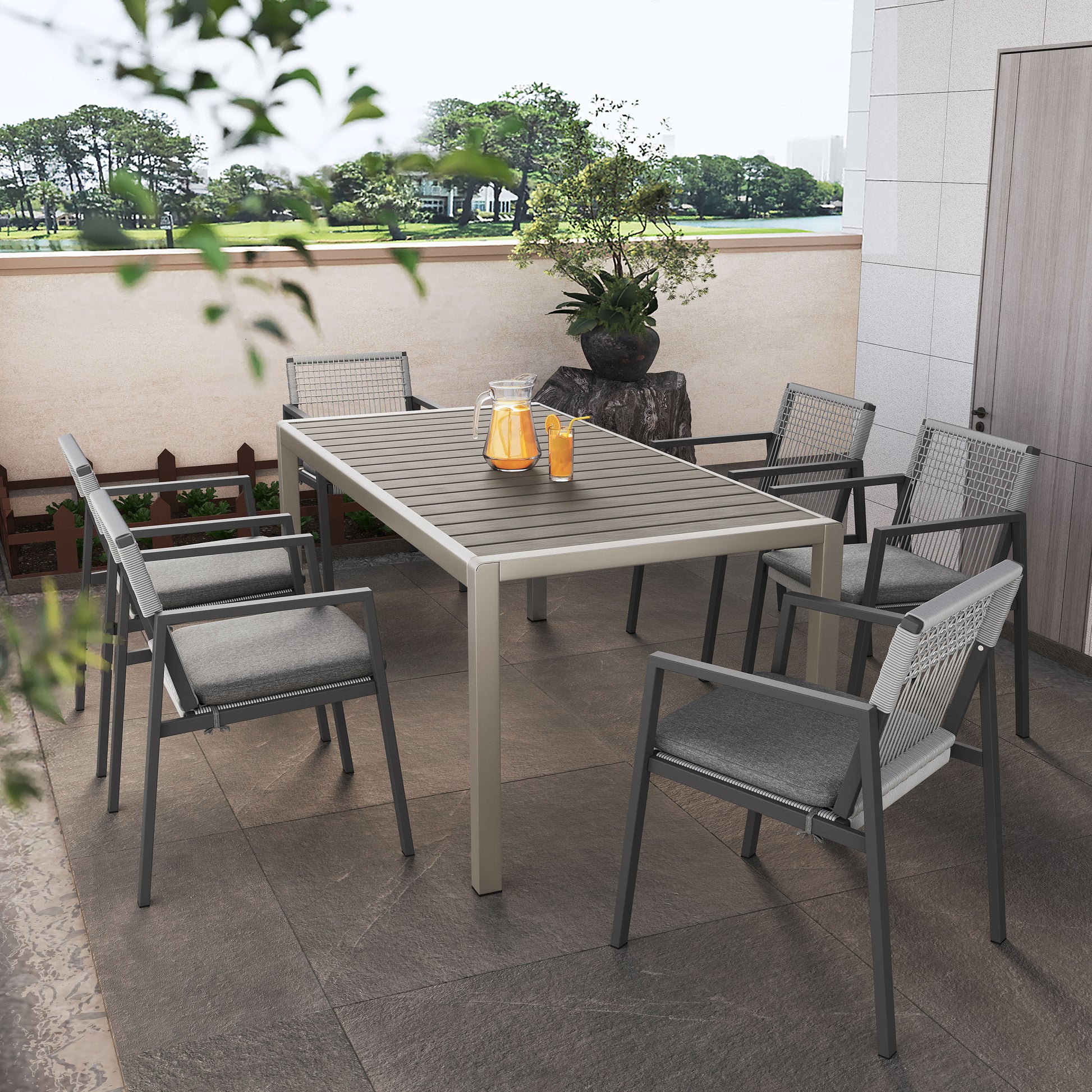 Modern grey aluminum patio dining set with comfortable upholstered chairs