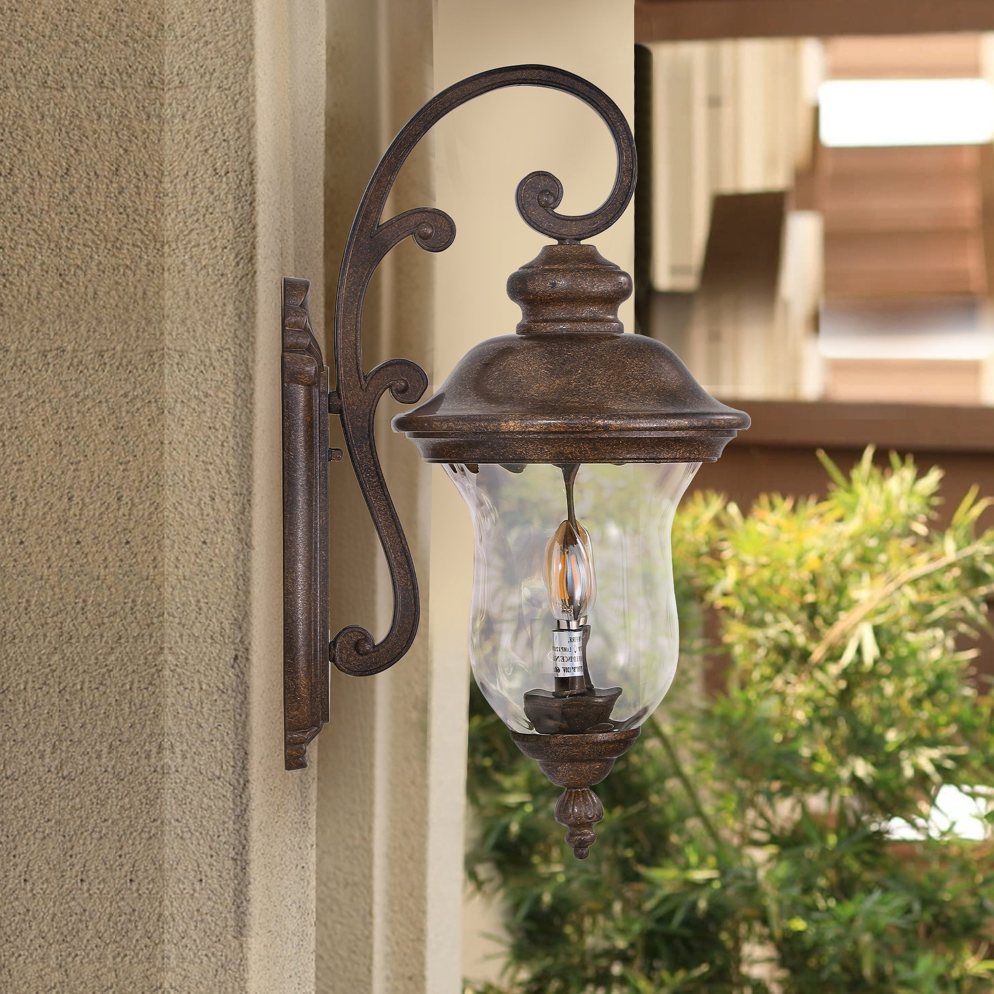 Rustic bronze outdoor wall lantern with clear glass shade