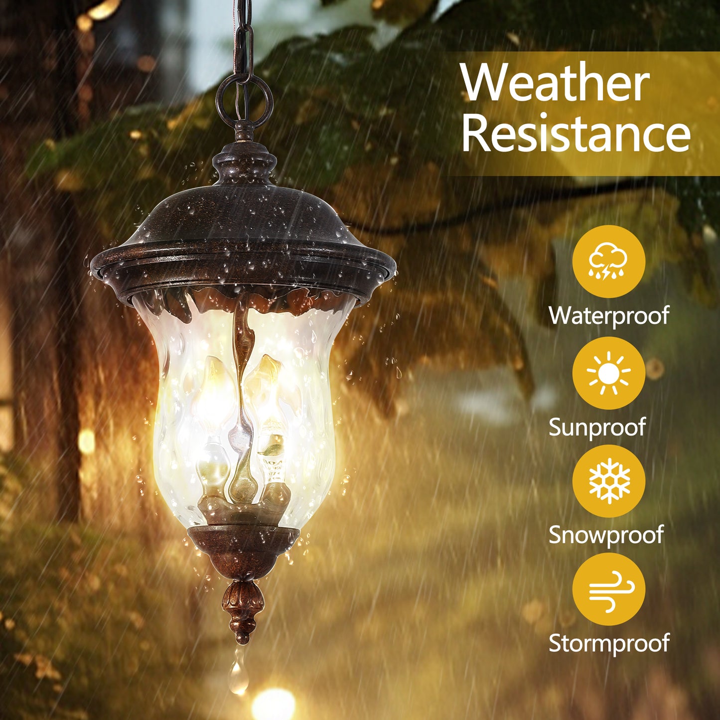 Ornate bronze outdoor pendant light with clear glass illuminated in rain