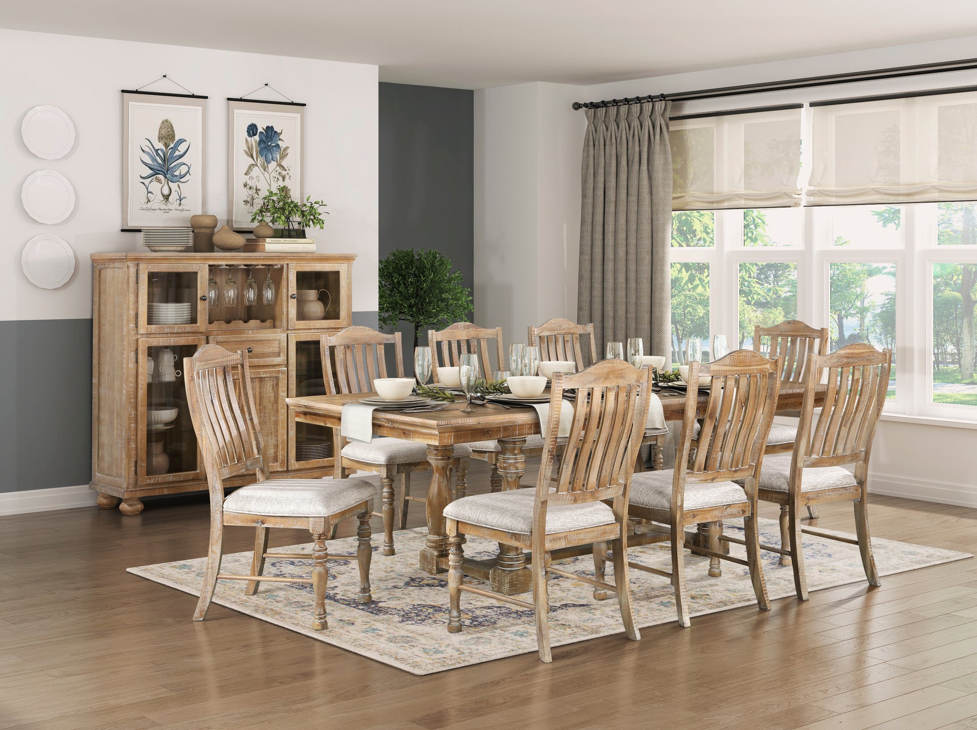 Distressed wood dining table with seating for eight featuring light gray upholstered chairs and neutral rug