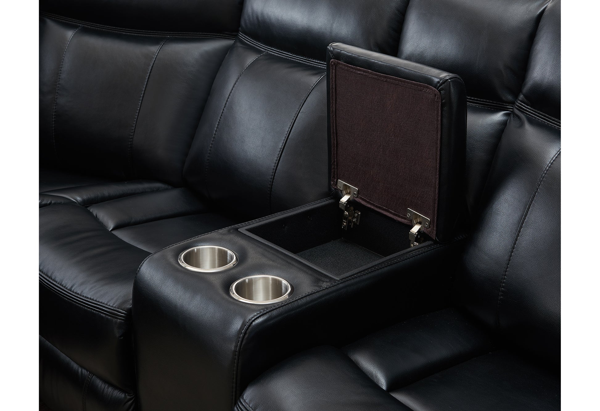 Close up of a black leather reclining sofa featuring two cup holders and an open storage compartment
