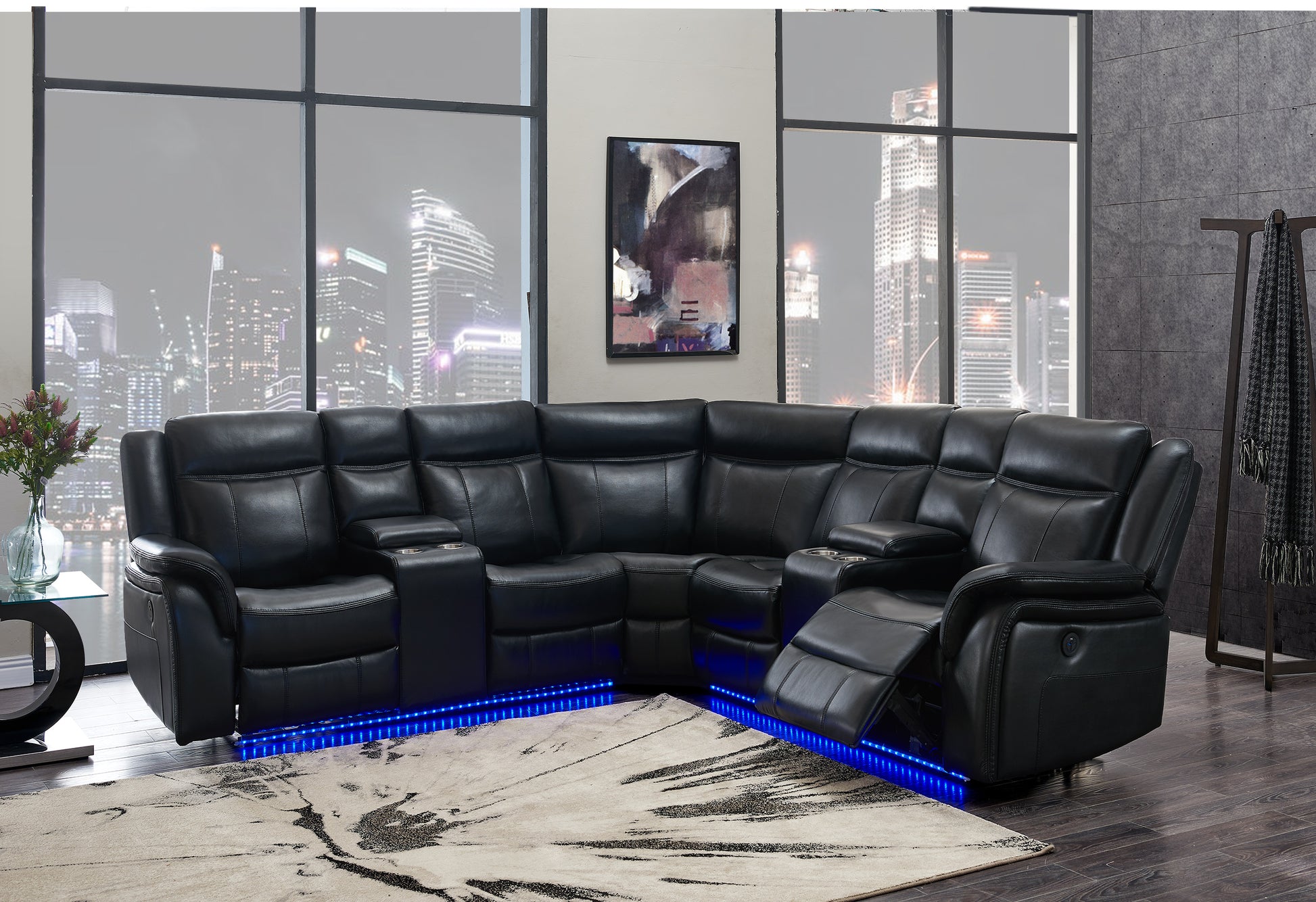 Black leather sectional sofa with reclining seats and blue LED underlighting ideal for a home theater