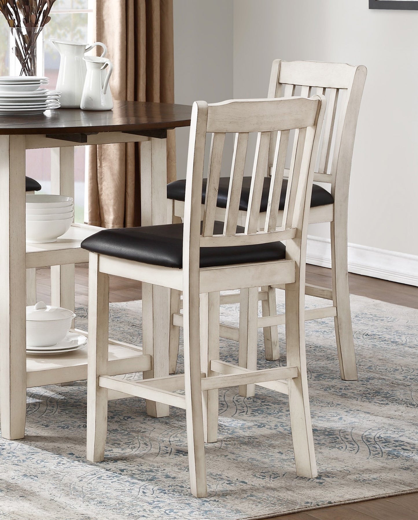 Antique white bar stool with black seat and slatted back