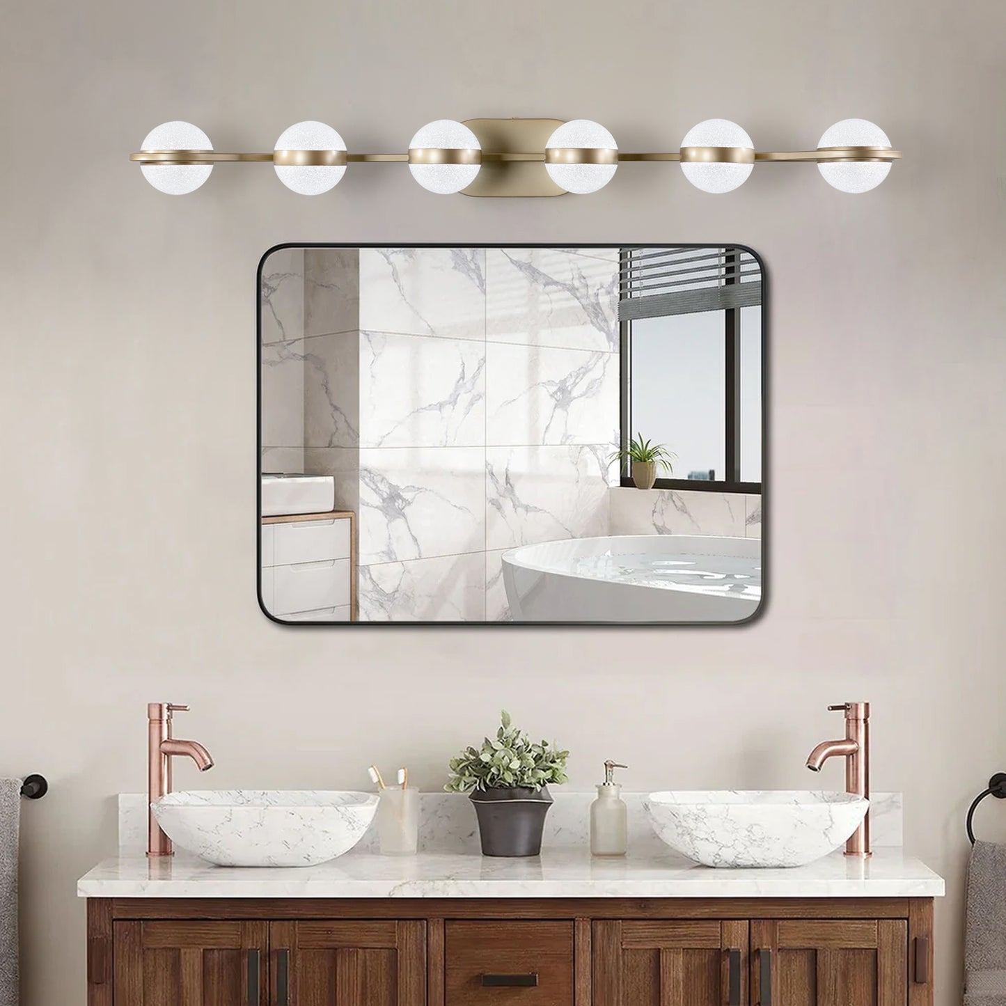 Modern brass vanity light with frosted glass globes for bathroom lighting