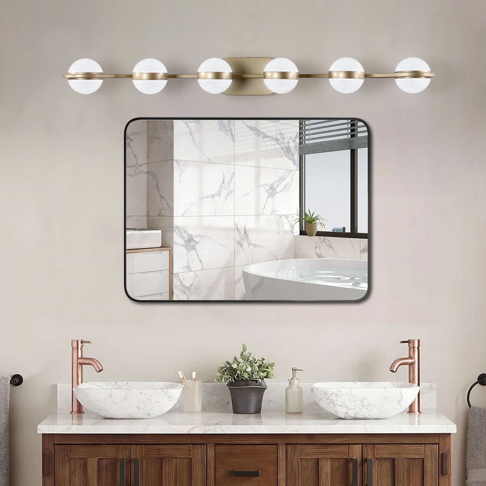 Modern brass vanity light with frosted glass globes for bathroom lighting