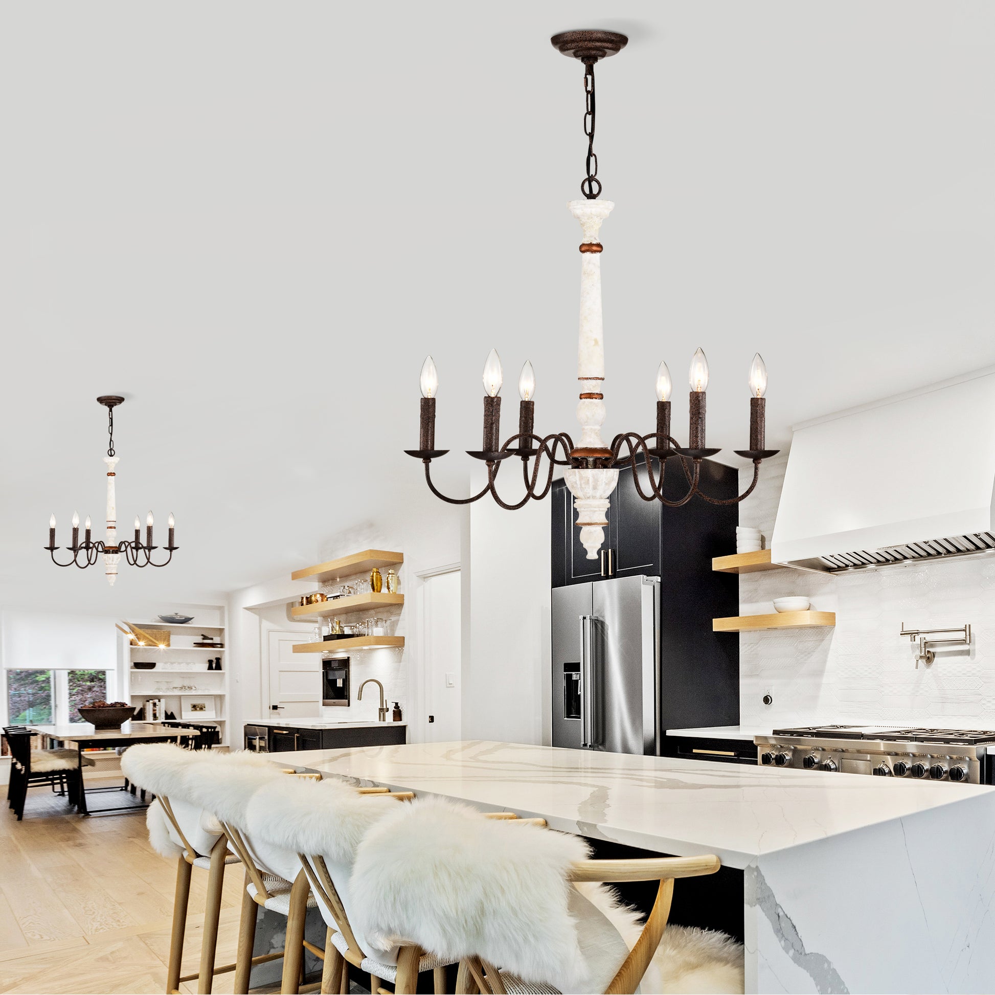 Rustic bronze chandelier with marble accents illuminates a modern kitchen island
