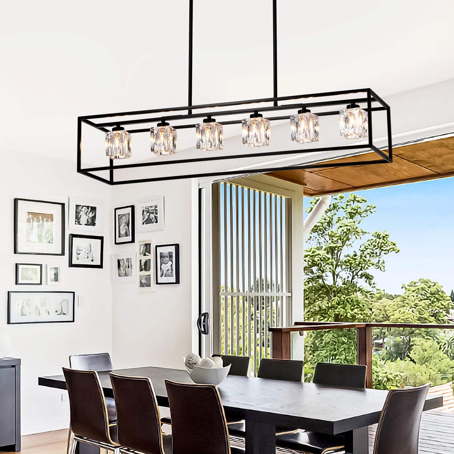 Black linear chandelier with six crystal glass shades above dining table