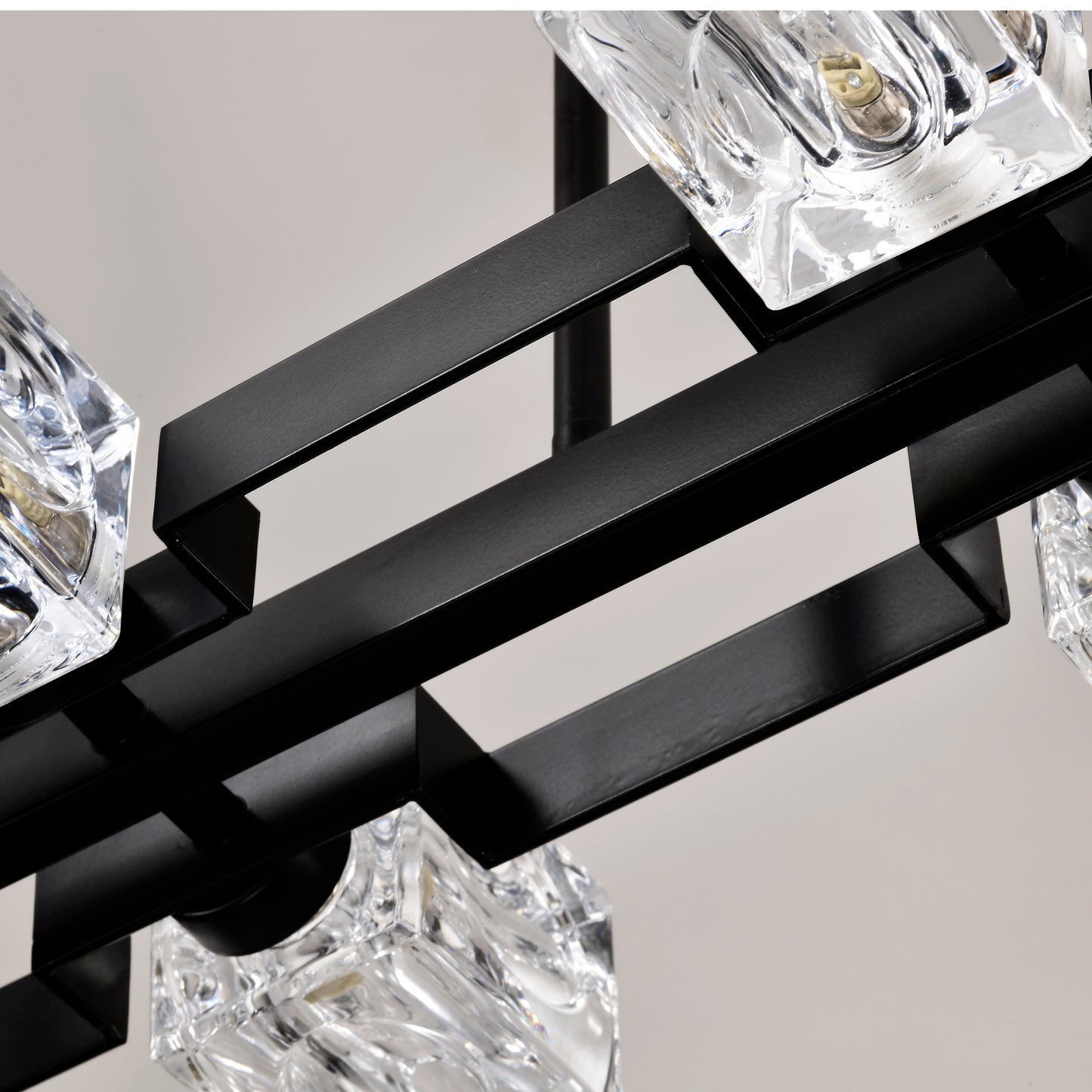 Modern black chandelier with faceted clear crystal accents