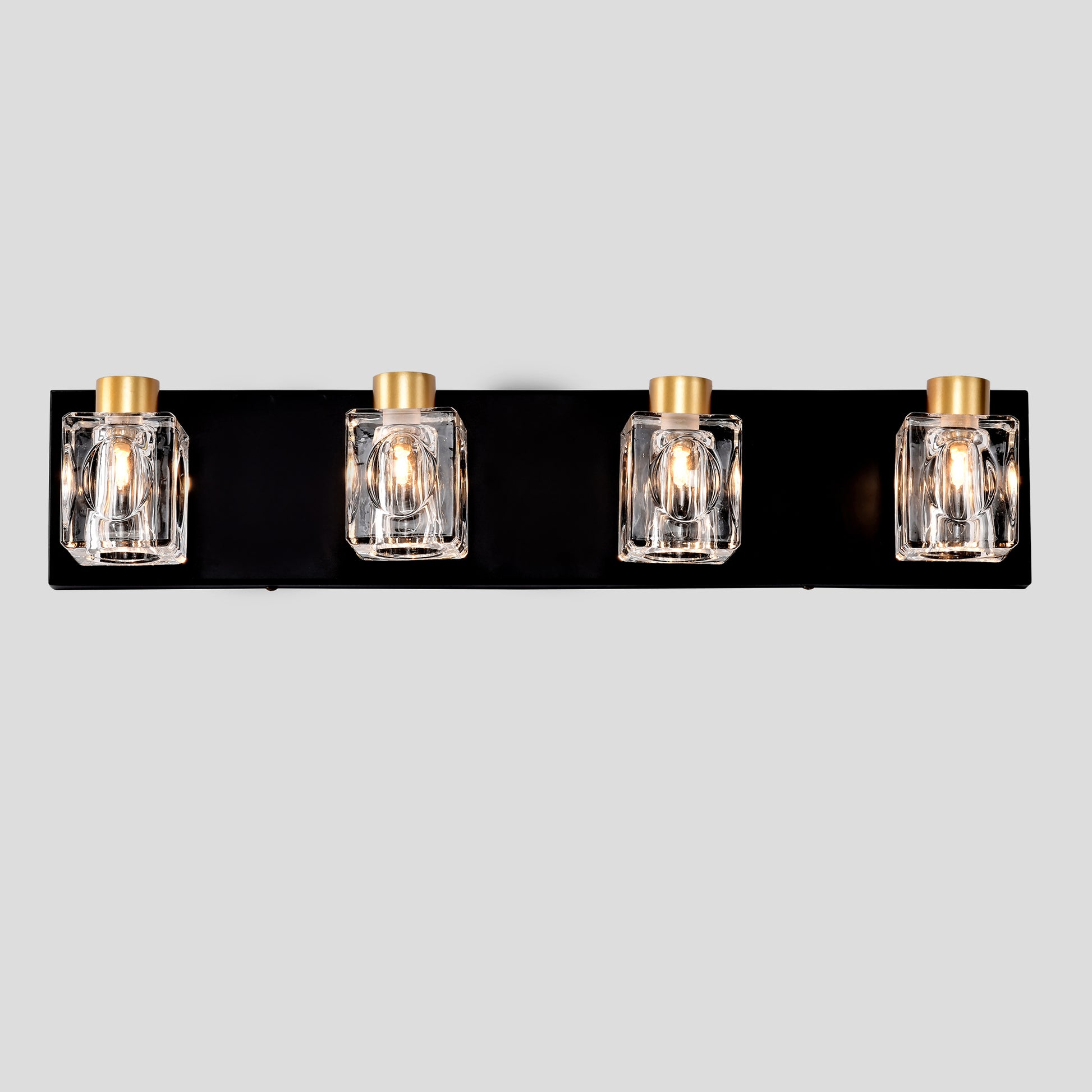 Black vanity light with four square clear glass shades and gold accents