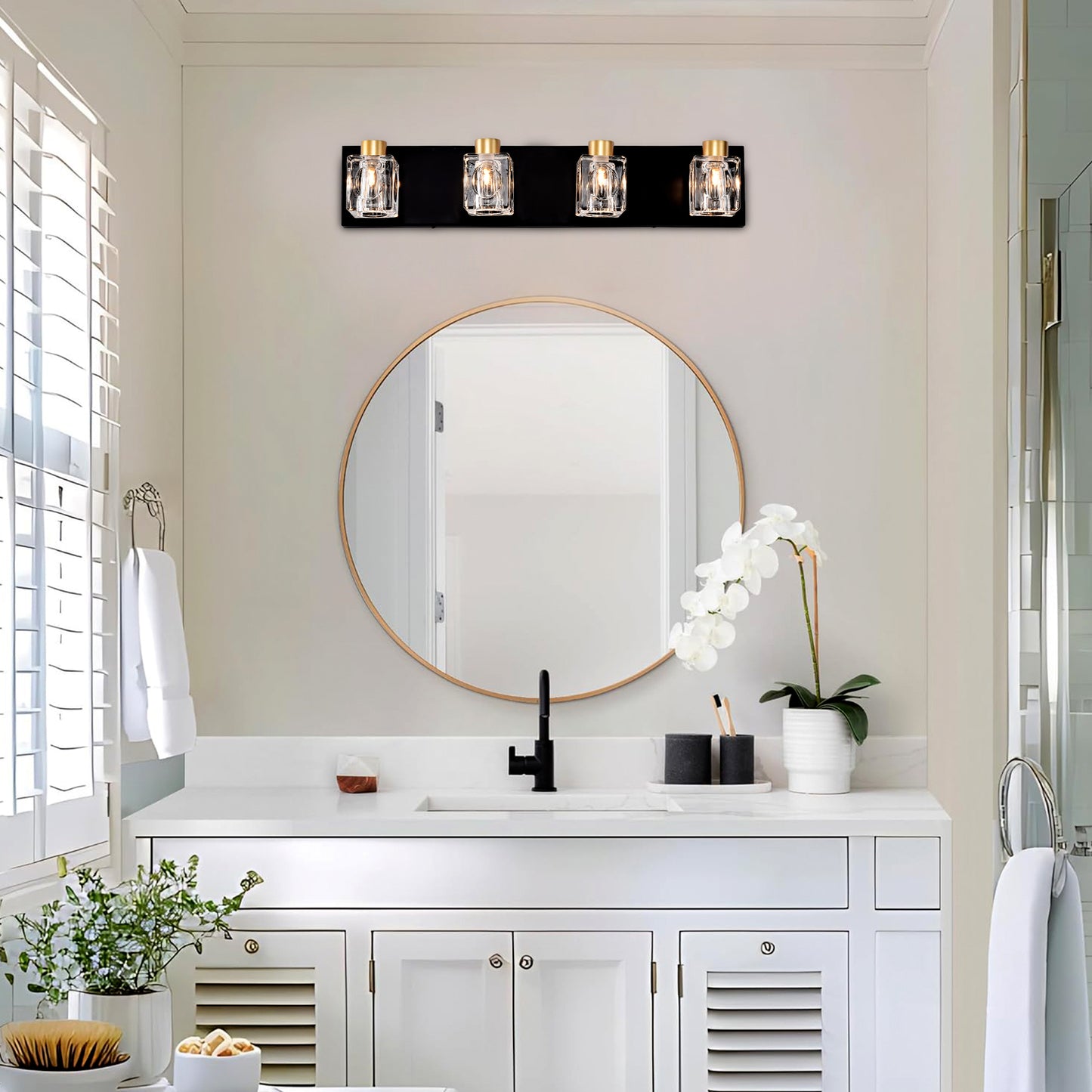 Fourlight black vanity light with clear glass shades and gold accents