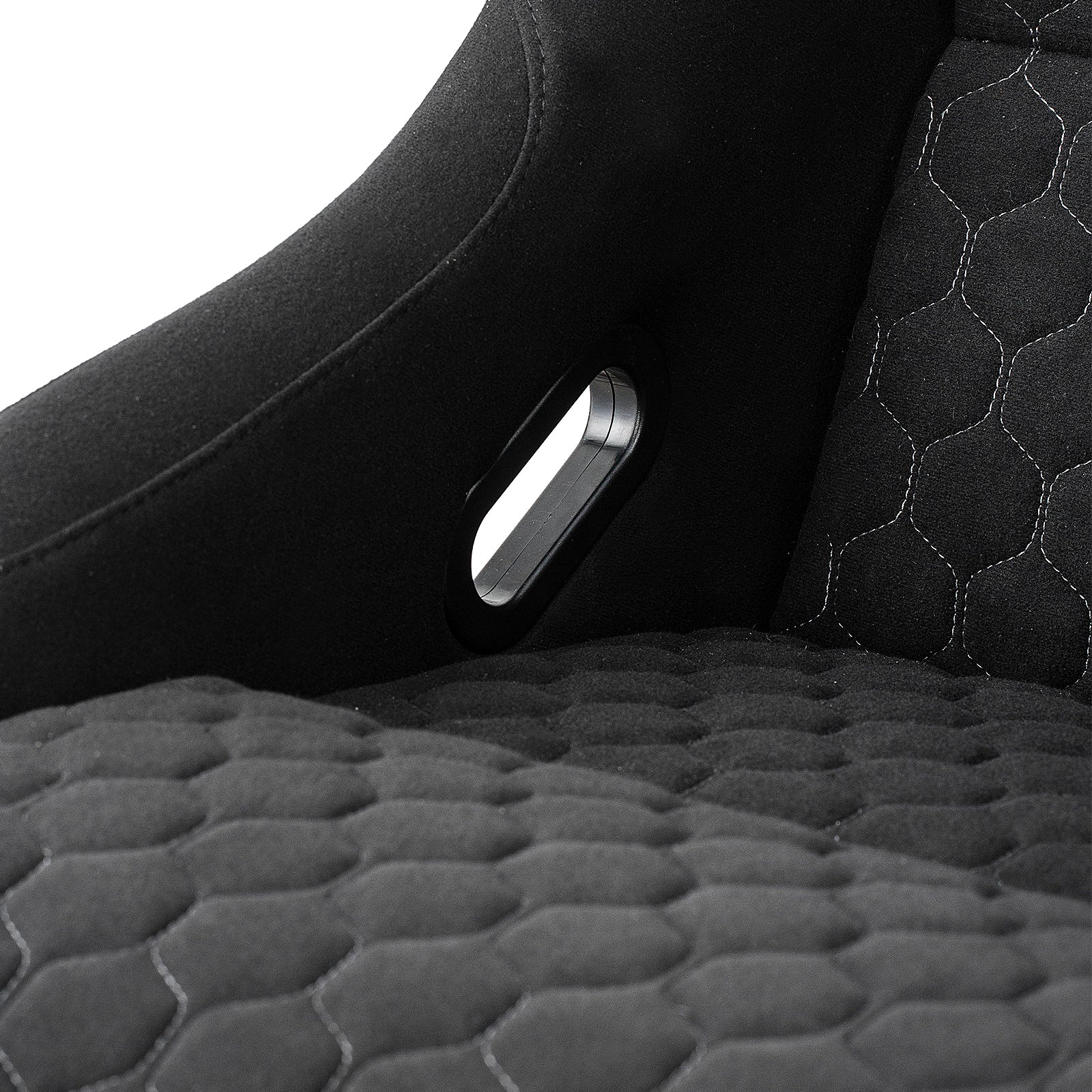 Black racing bucket seat with hexagonal stitching and harness cutout detail