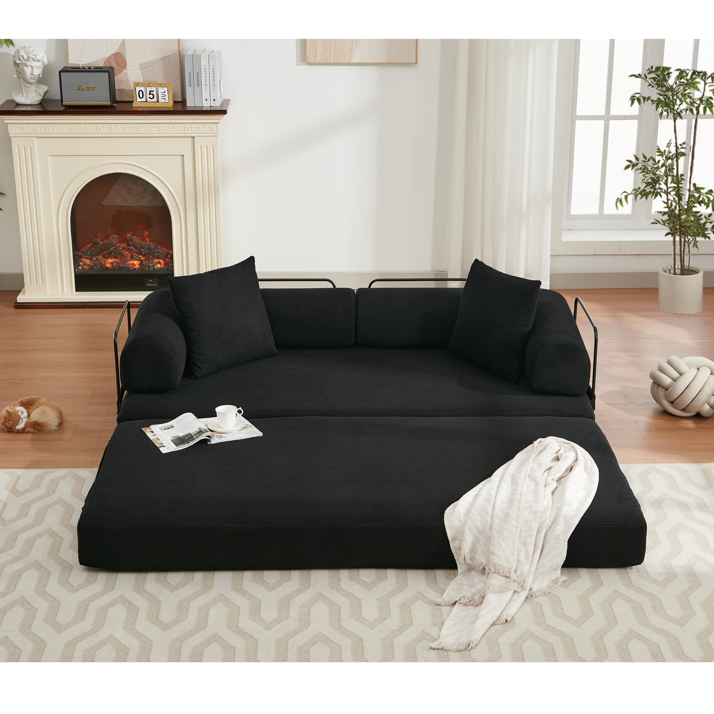 Black corduroy sofa bed with tufted cushions and metal frame versatile for small spaces
