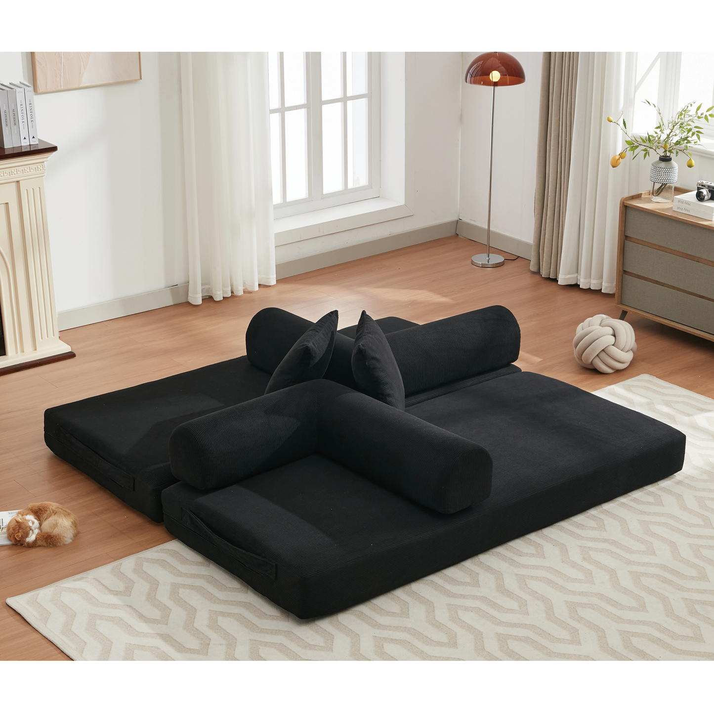 Black modular sofa with lumbar pillows and accent cushions ideal for modern living rooms