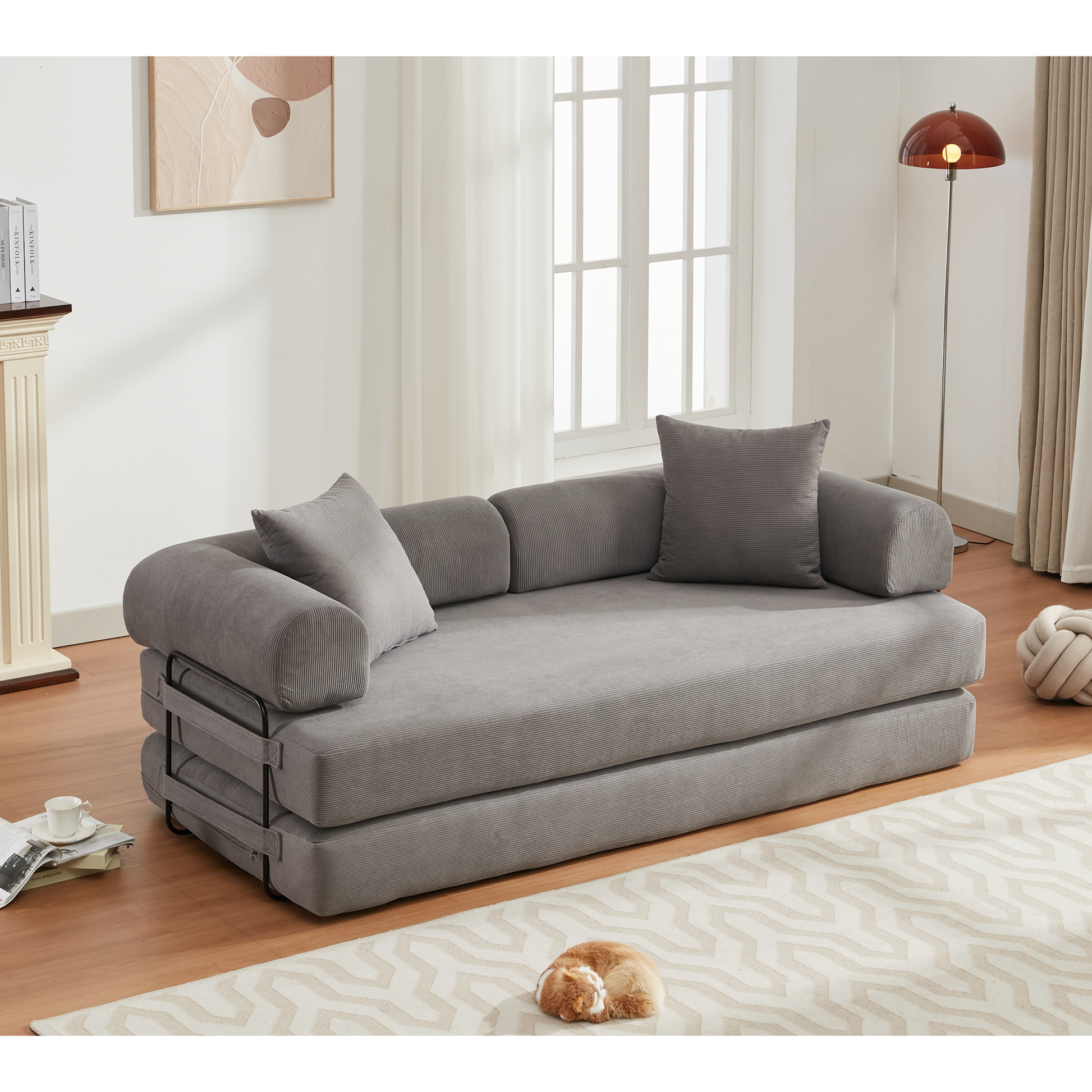 Gray corduroy sofa bed with lumbar pillows perfect for small apartments