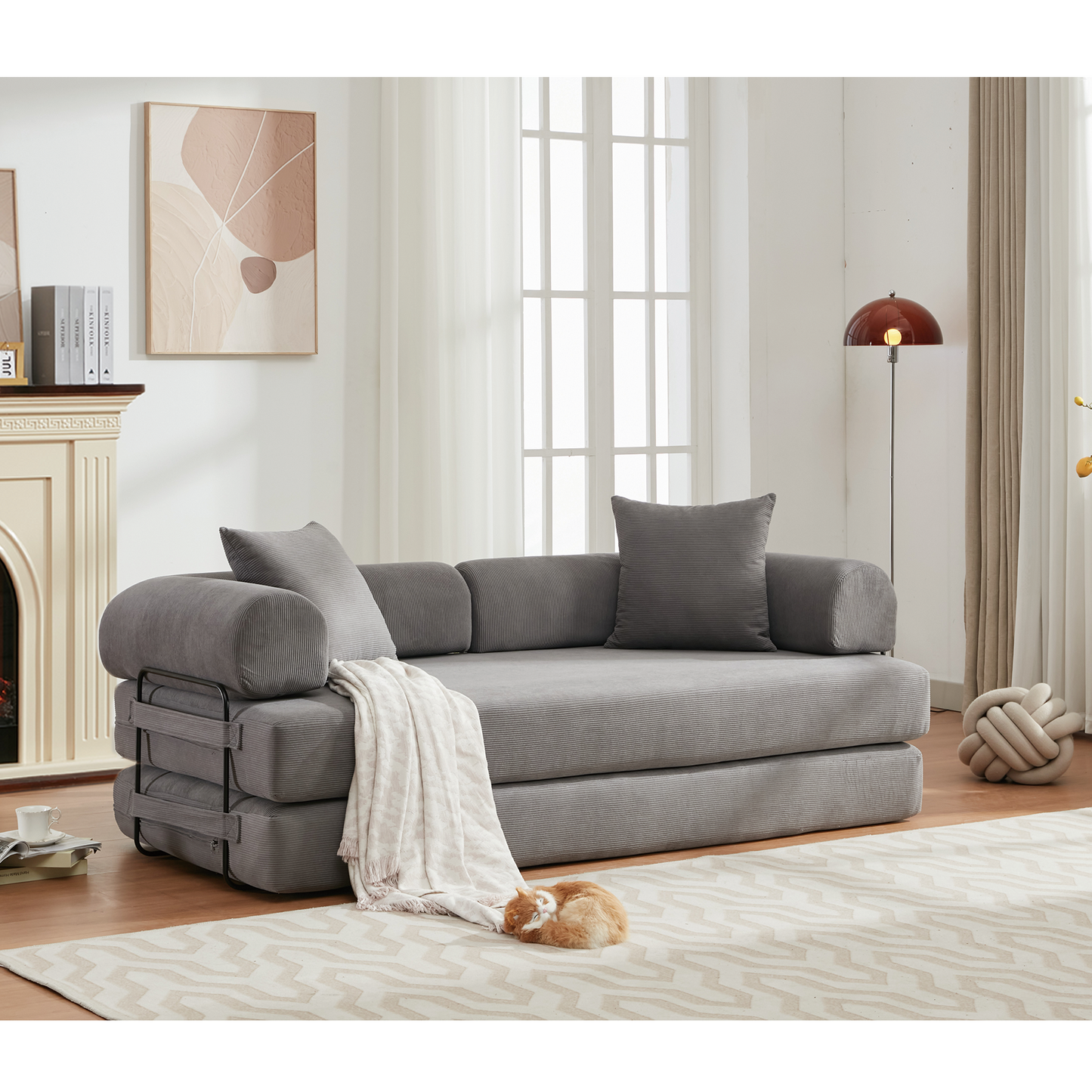 Gray corduroy sofa bed with metal frame and throw blanket