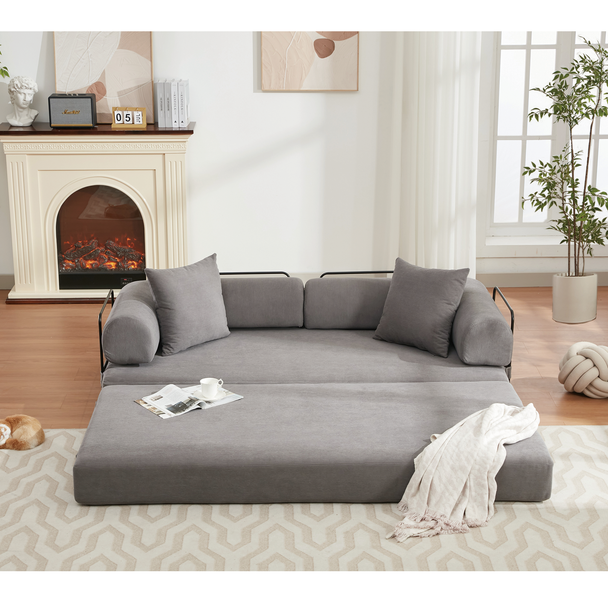 Gray corduroy sleeper sofa with lumbar pillow extended for sleeping