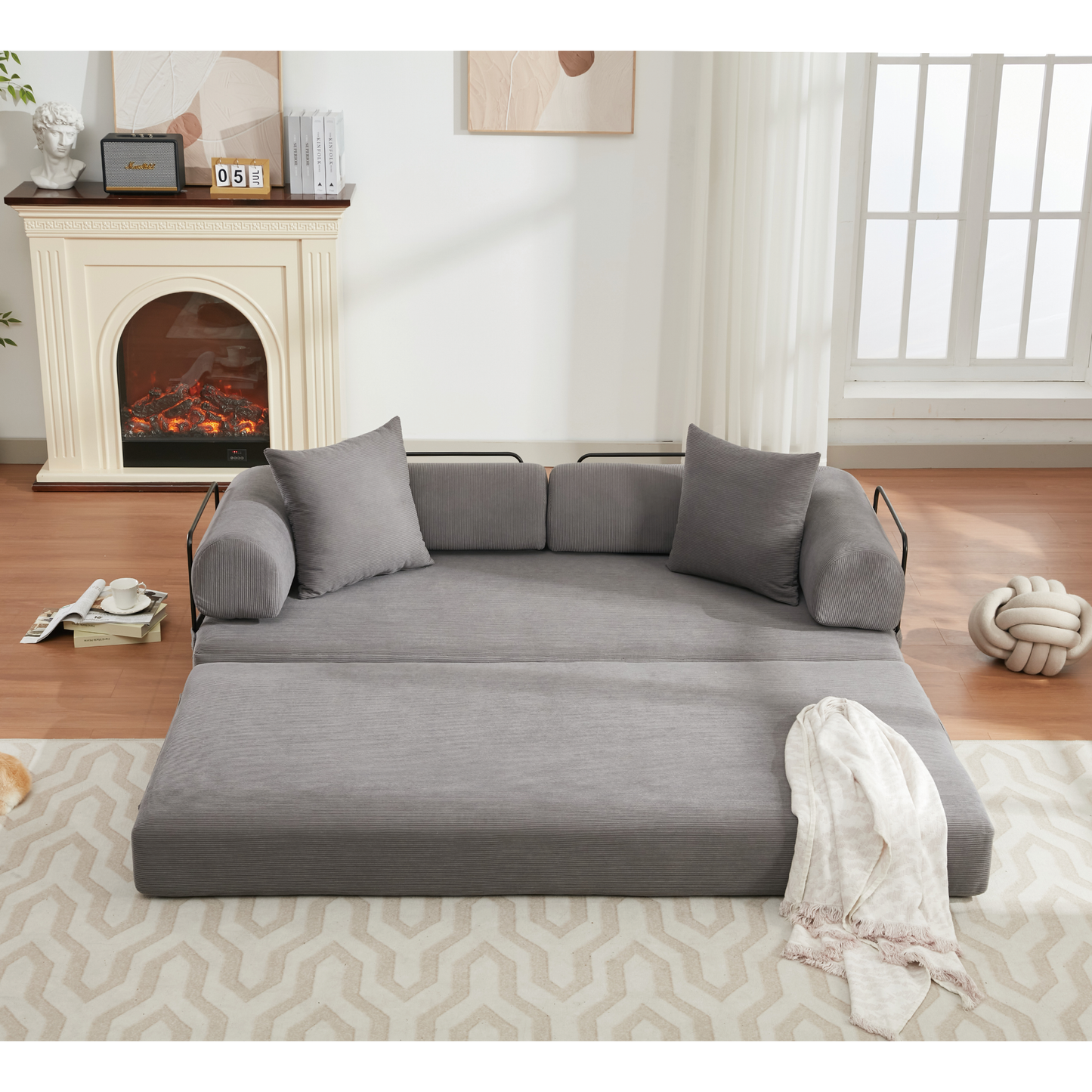 Convertible sofa bed in textured grey fabric featuring plush cushions for comfortable seating