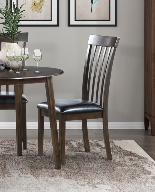 Dark wood dining chair with black leather seat and slatted back