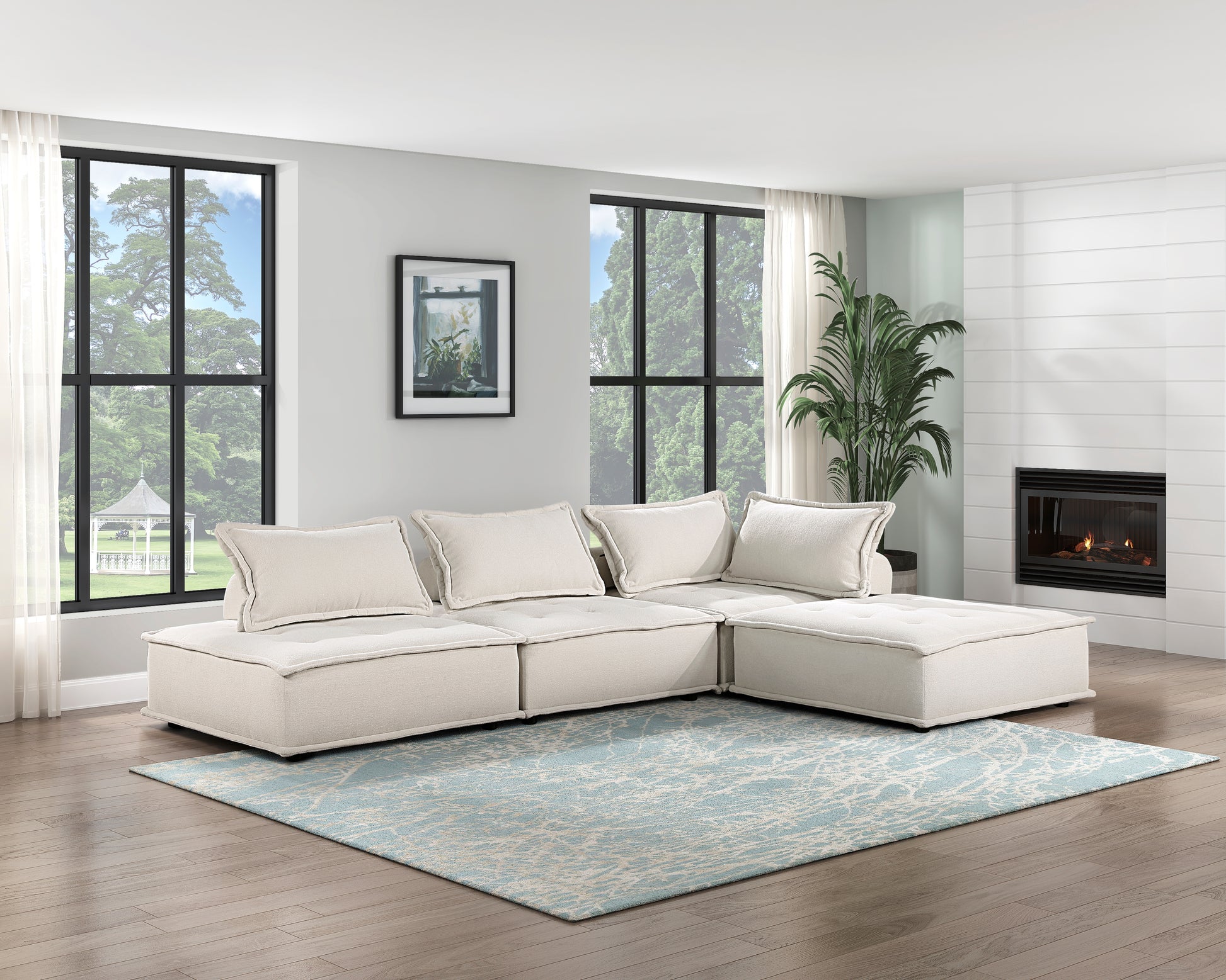 Cream modular sectional sofa with tufted cushions on a blue abstract rug