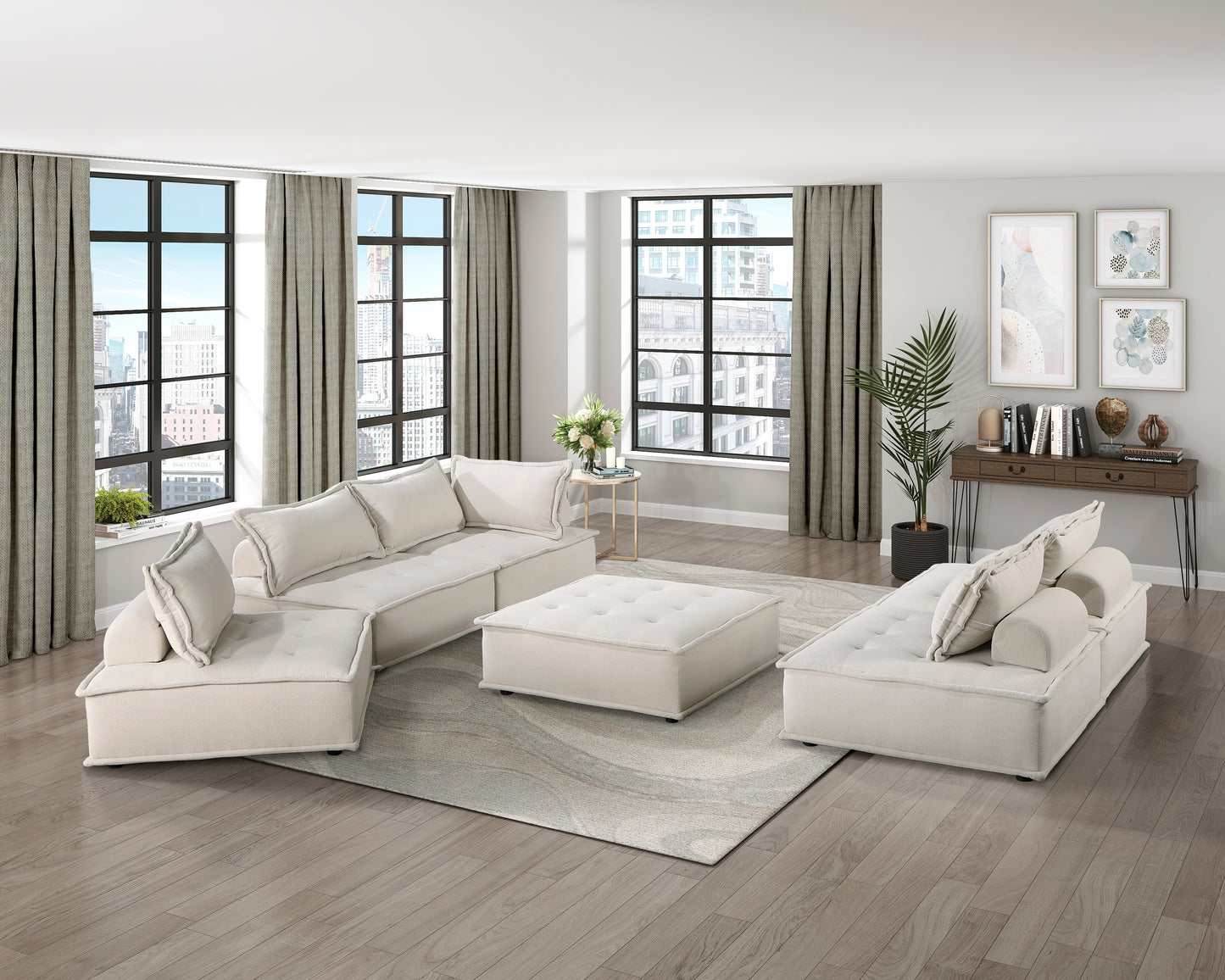 Cream modular sectional sofa with plush cushions on a patterned rug modern living room