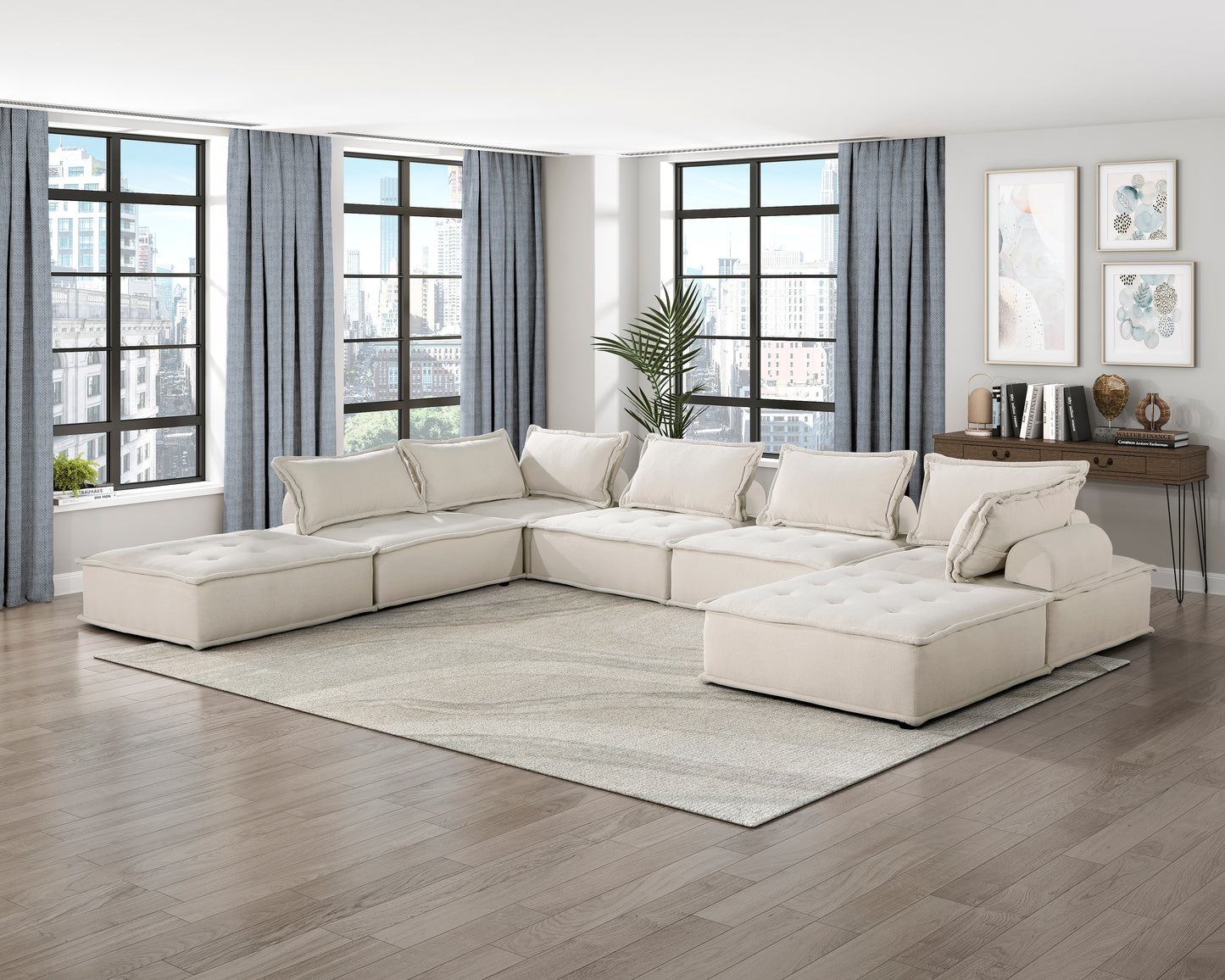 Ushaped sectional sofa in beige fabric with tufted seat cushions and plush pillows