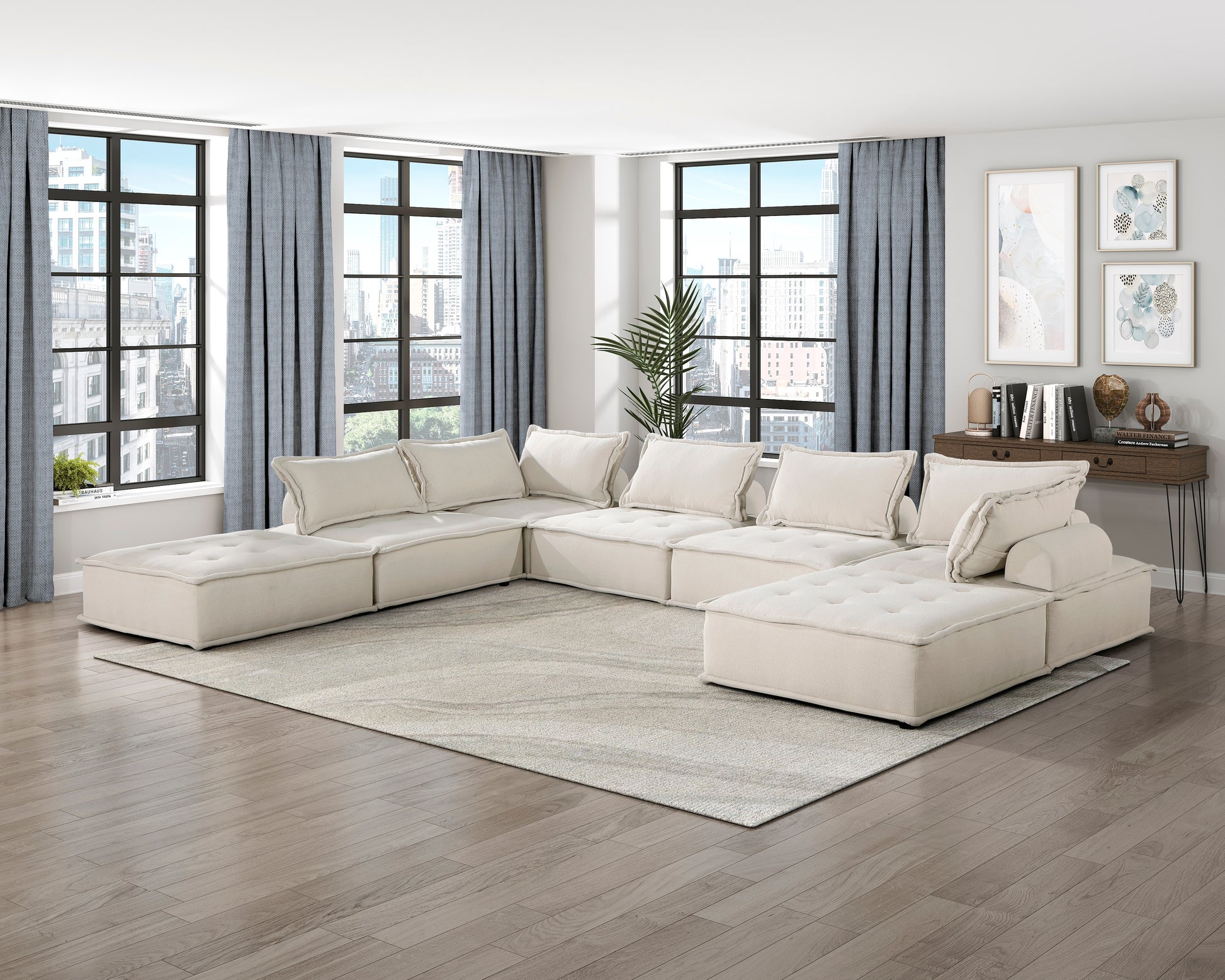 Ushaped sectional sofa in beige fabric with tufted seat cushions and plush pillows