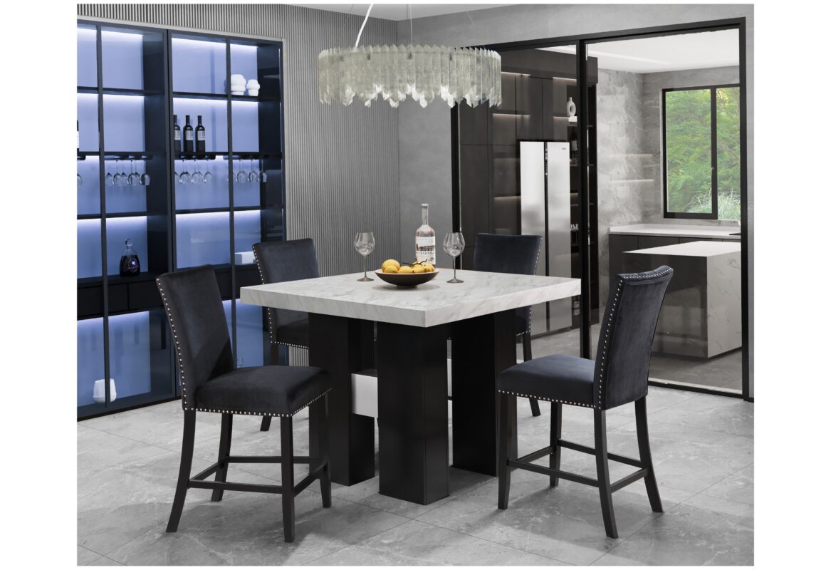 Black velvet bar stools with nailhead trim surround a square marblelook pub table