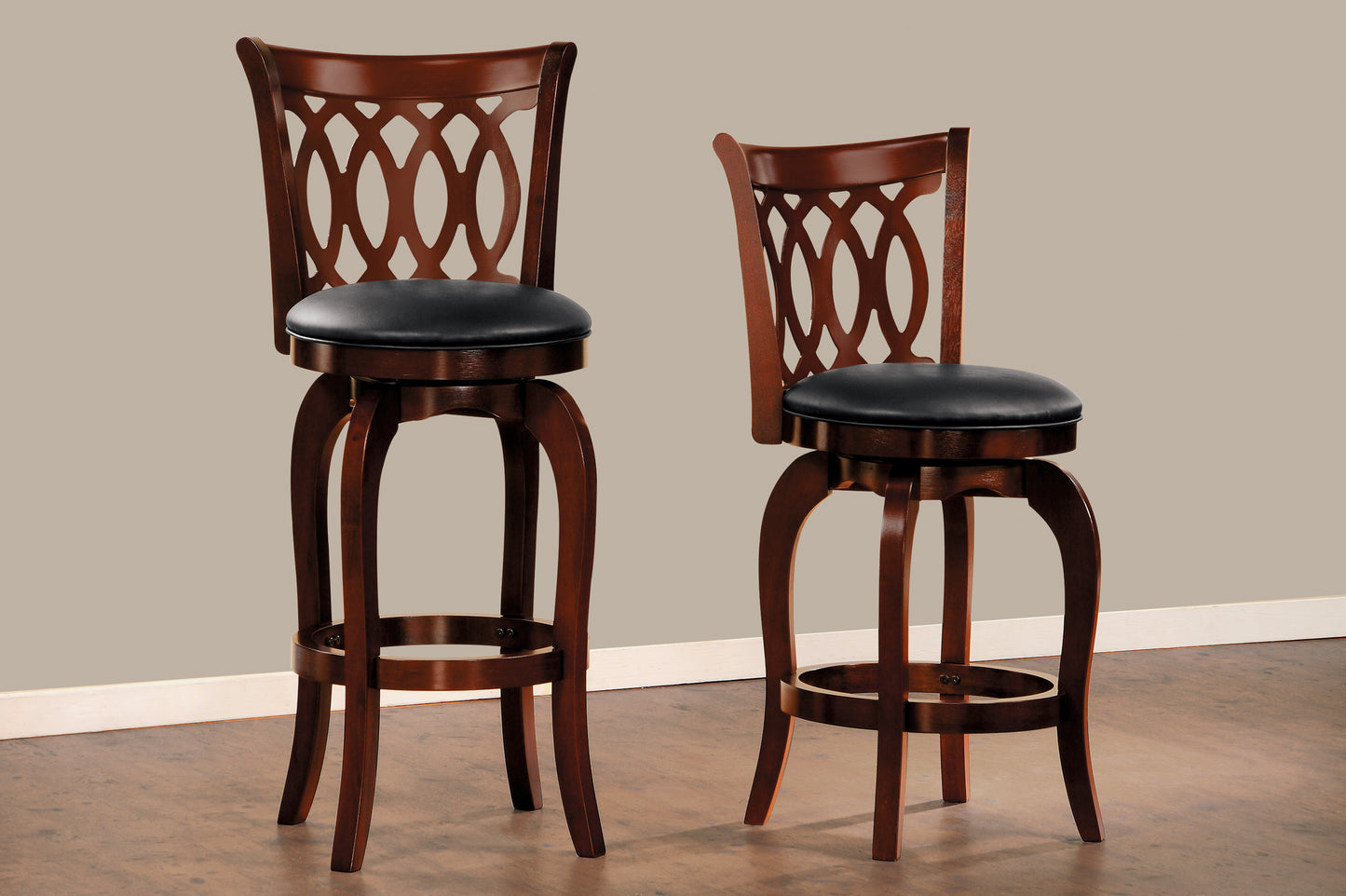 Two dark cherry swivel bar stools with black vinyl seats and ornate backs