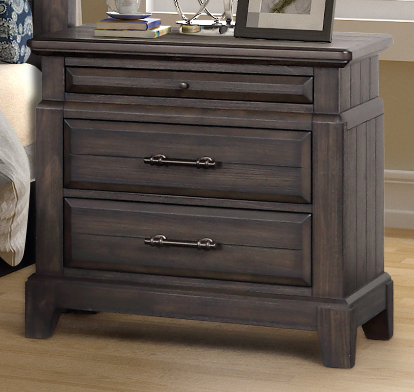 Dark wood nightstand with three drawers and brushed nickel hardware