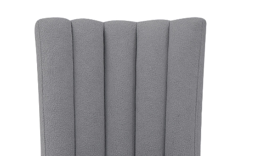 Textured gray upholstered chair back with vertical channeling detail