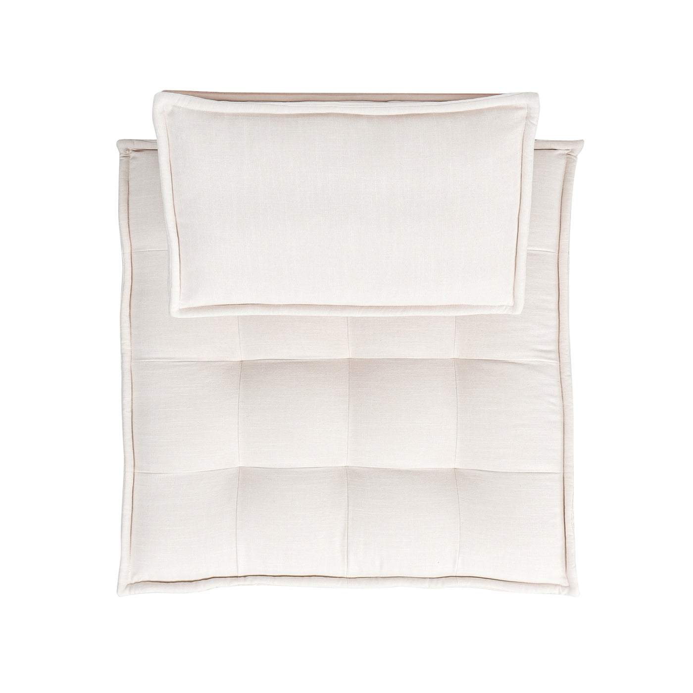 Cream upholstered accent chair with tufted seat and separate headrest pillow