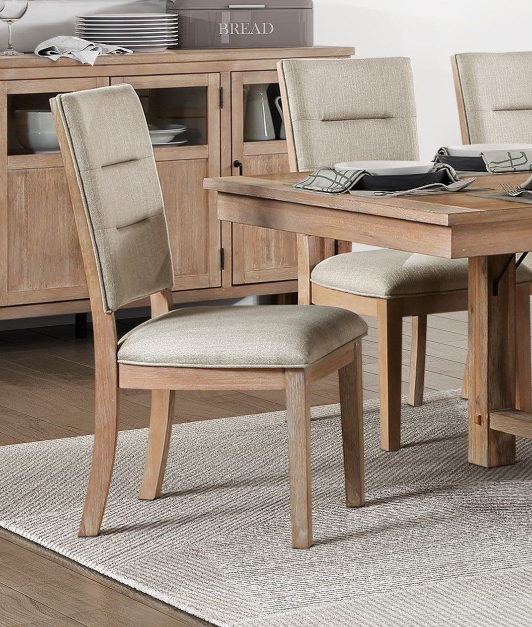 Light beige upholstered dining chair with natural wood legs
