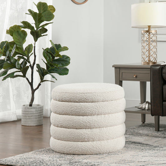 Cream boucle upholstered round ottoman with stacked design