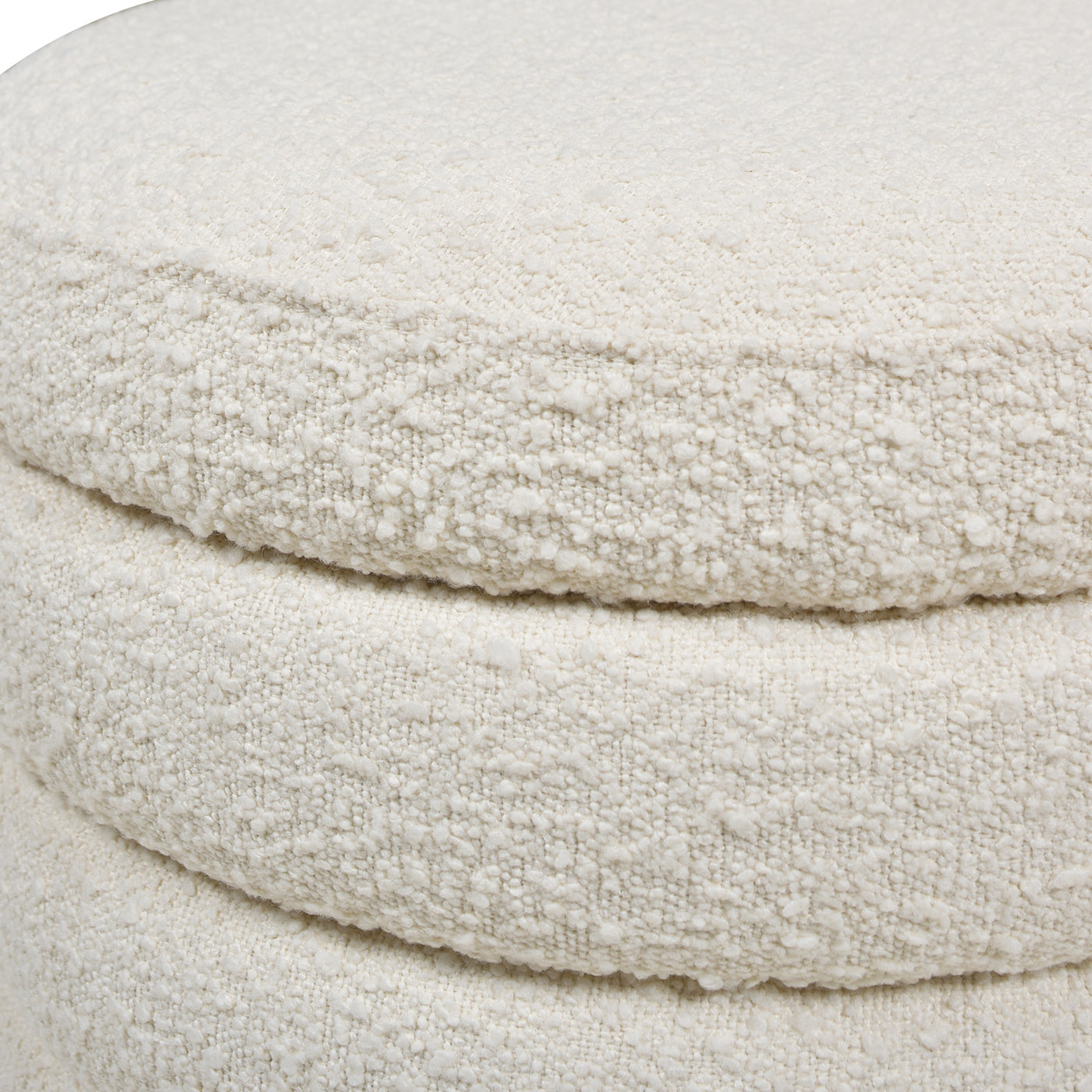 Textured cream fabric ottoman with layered rounded cushion design