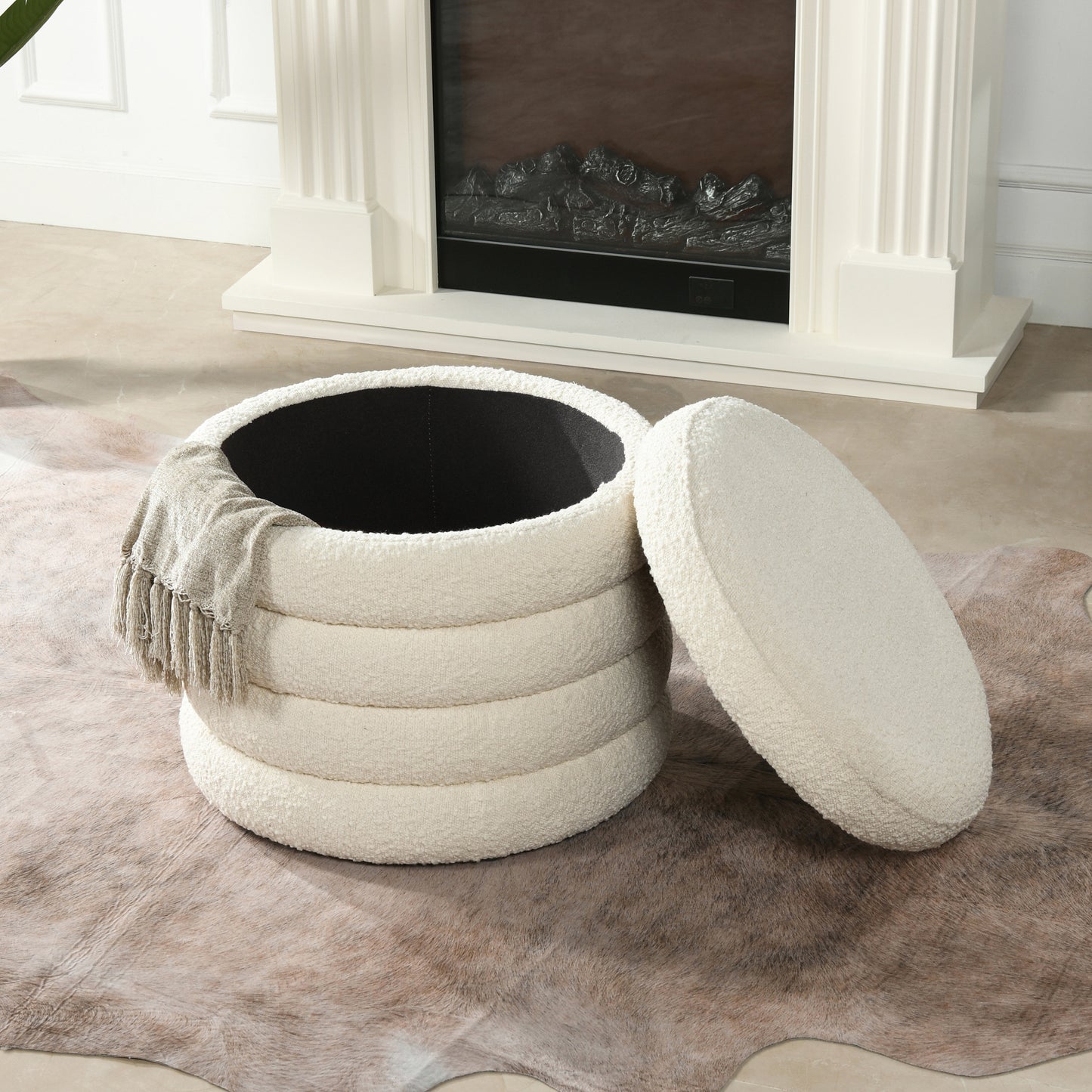 Round boucle ottoman in cream with a removable lid and plush texture perfect for entryway seating