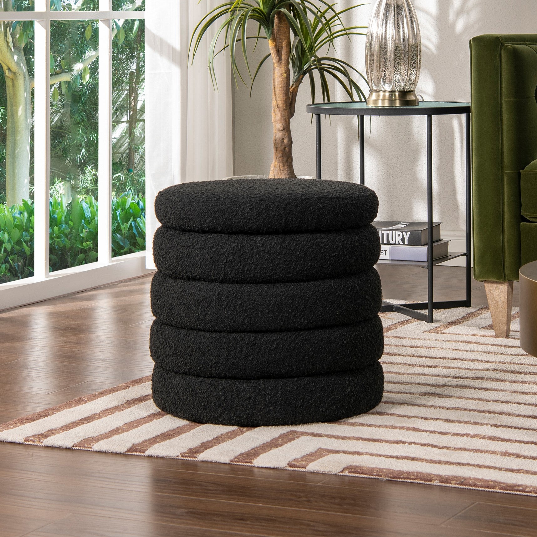 Black round textured ottoman stacked five high perfect for a modern living room