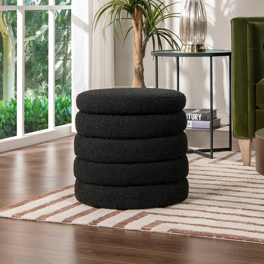Black round textured ottoman stacked five high perfect for a modern living room