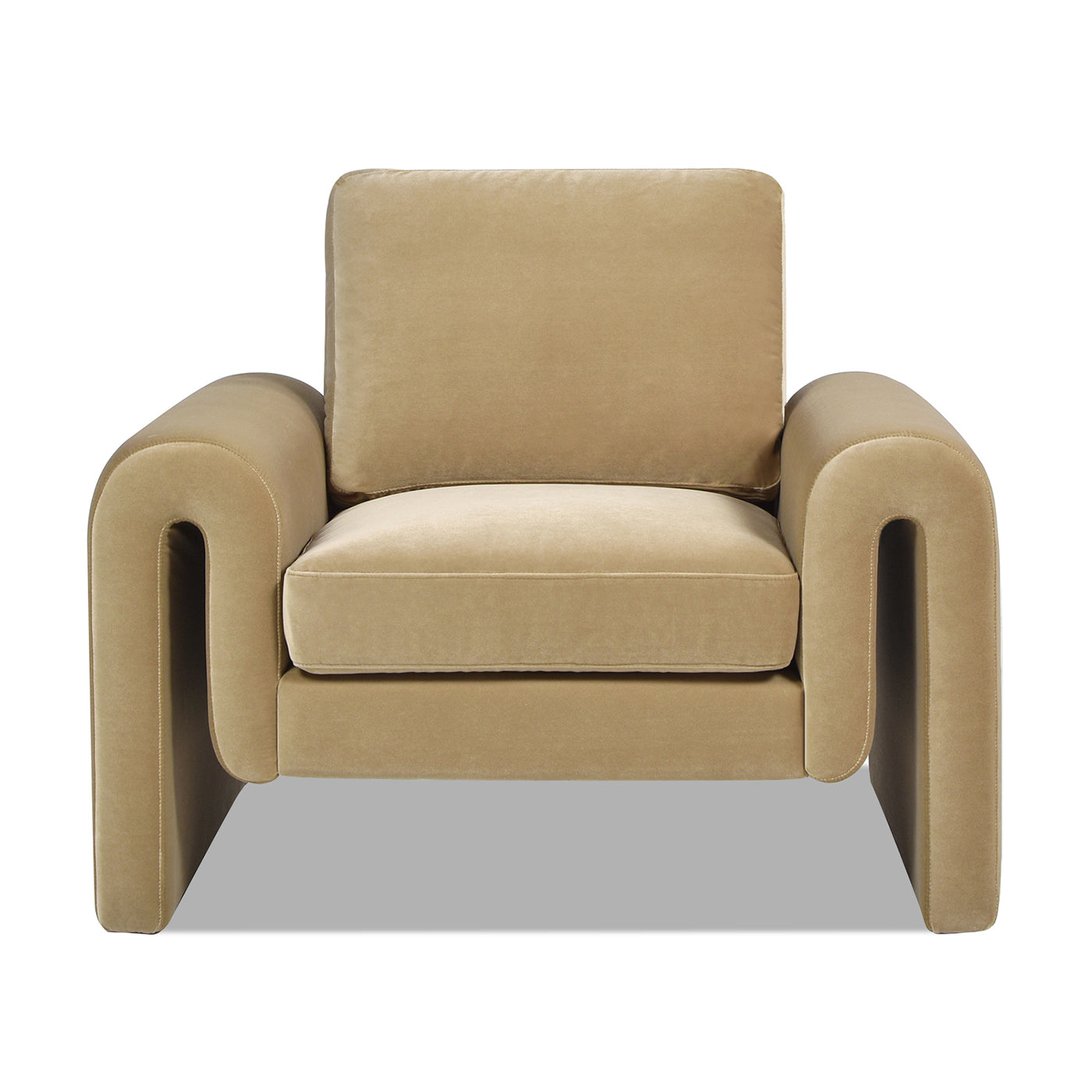 Plush beige velvet armchair with curved arms and deep seat cushions