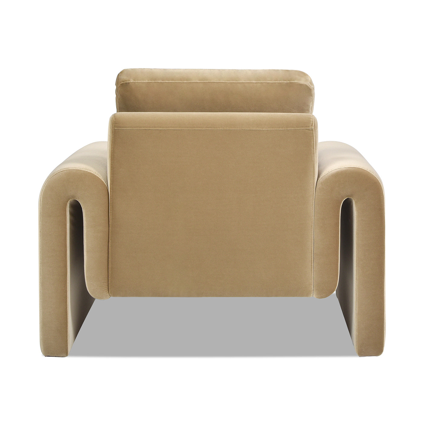 Back view of plush beige velvet armchair with curved armrests