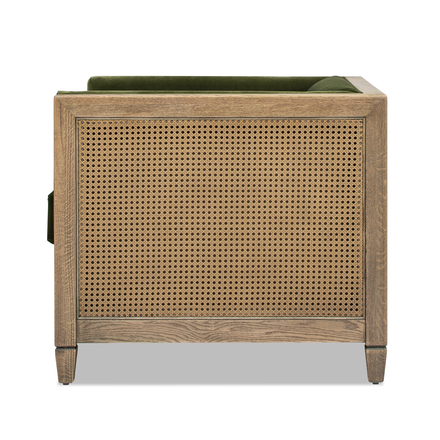 Green velvet armchair with natural oak frame and cane detailing