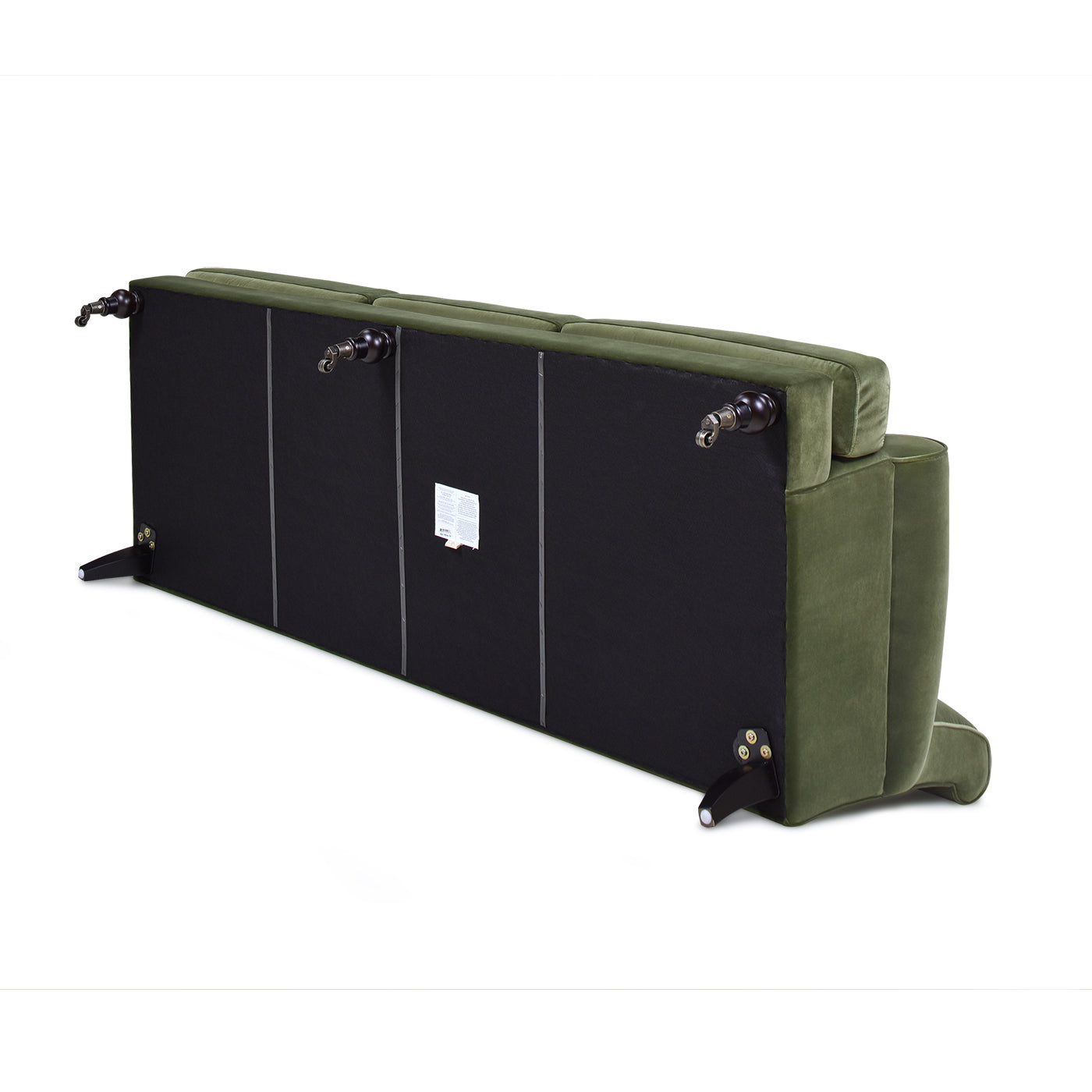Green velvet sofa showcasing its underside and decorative wooden legs