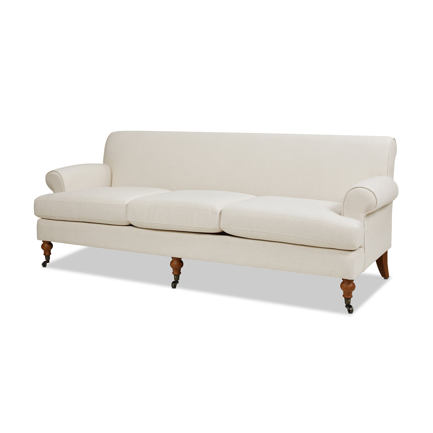 Classic cream linen sofa with rolled arms and brass casters