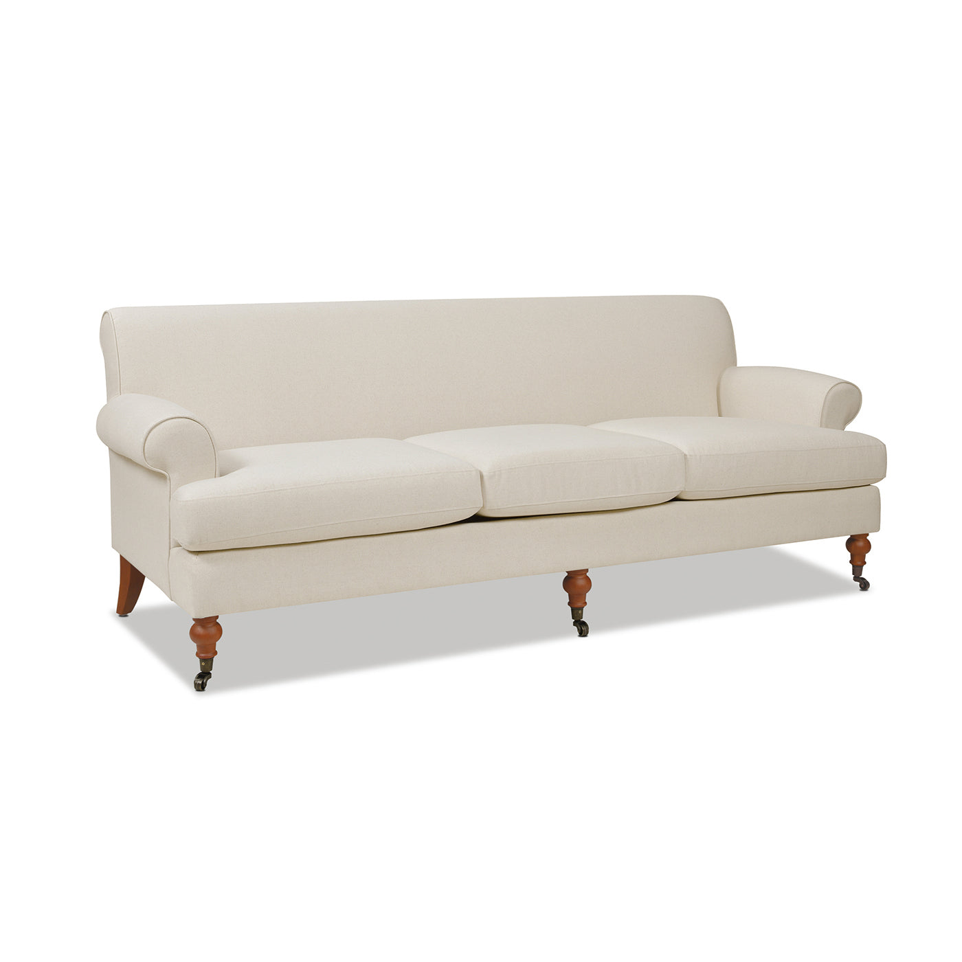 Classic cream linen threeseater sofa with turned wooden legs and casters