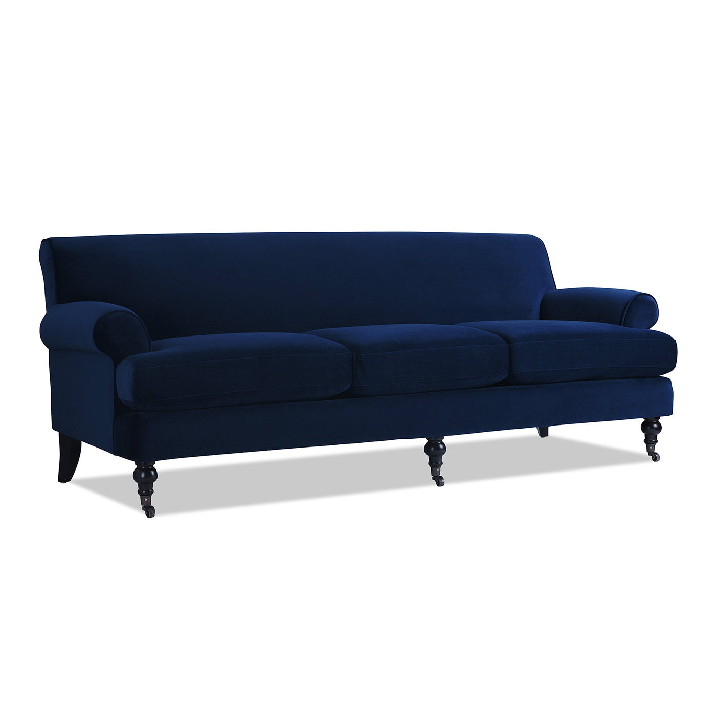Navy blue velvet Chesterfield sofa with rolled arms and dark wooden legs with casters