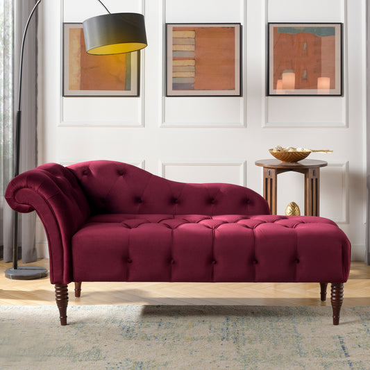 Velvet chaise lounge in a rich burgundy color with tufted detailing and scrolled armrest
