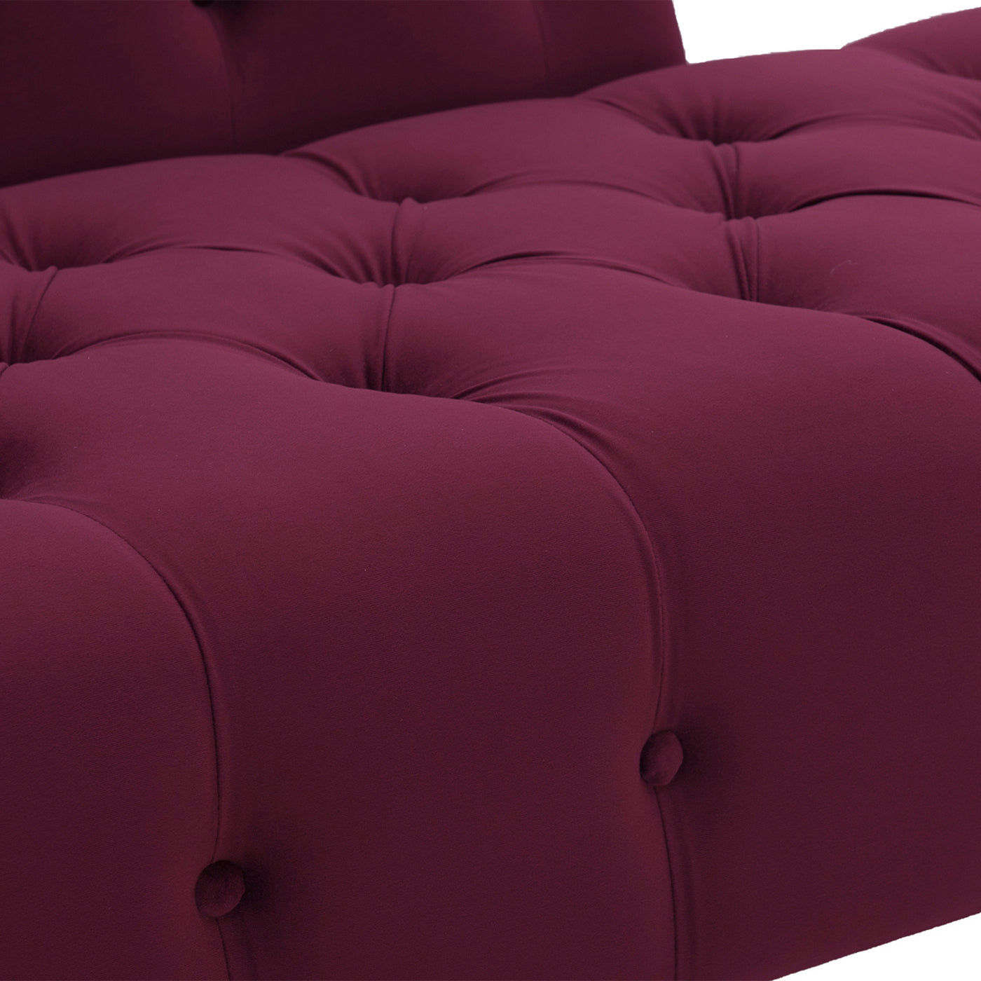 Deep plum velvet tufted chaise lounge closeup of button details