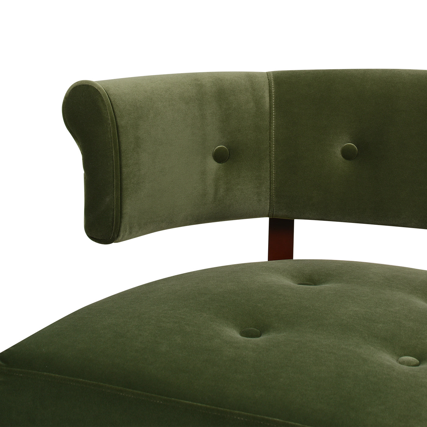 Closeup of a plush olive green velvet armchair with tufted detailing